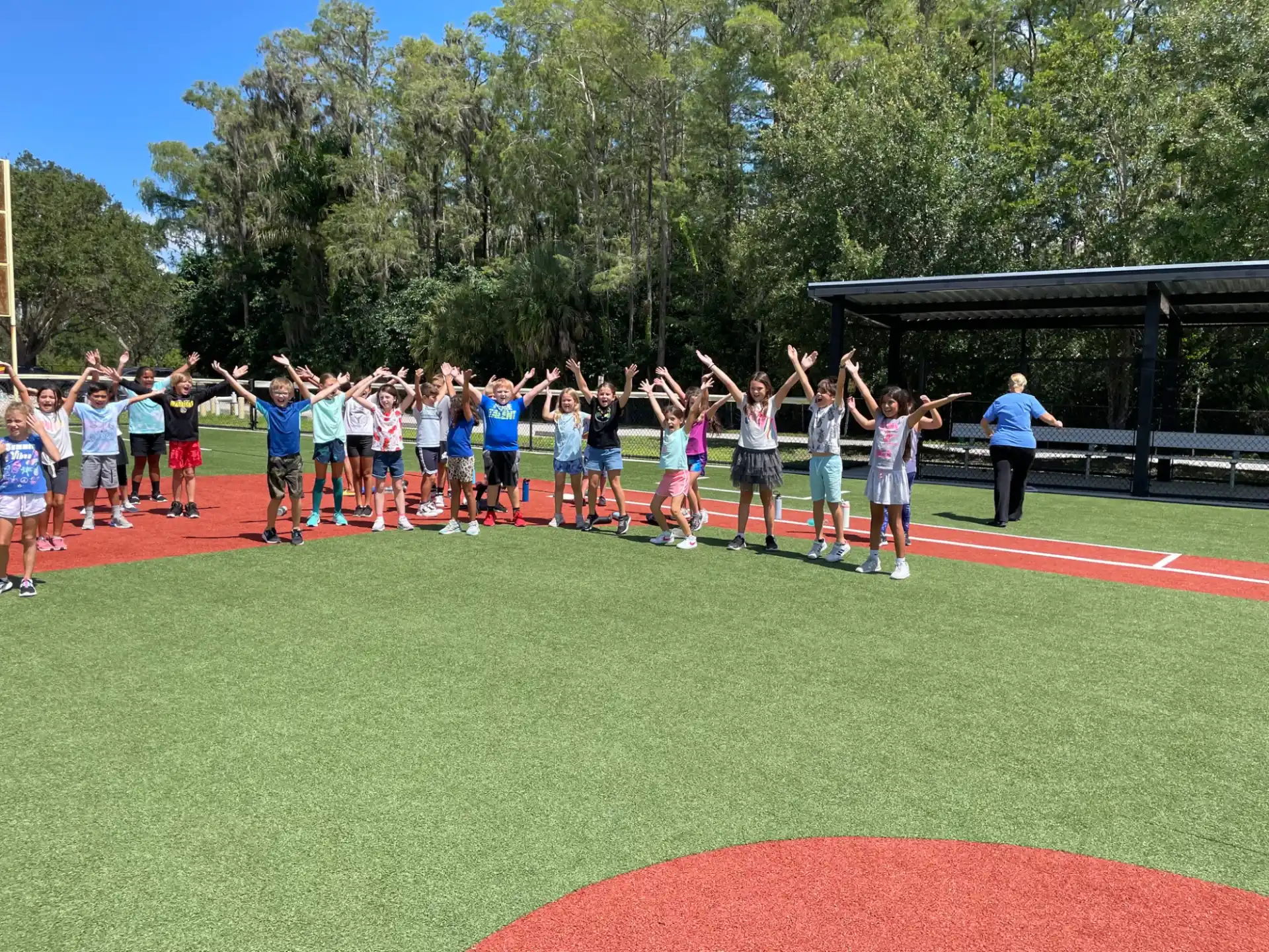 a group of people standing on a field