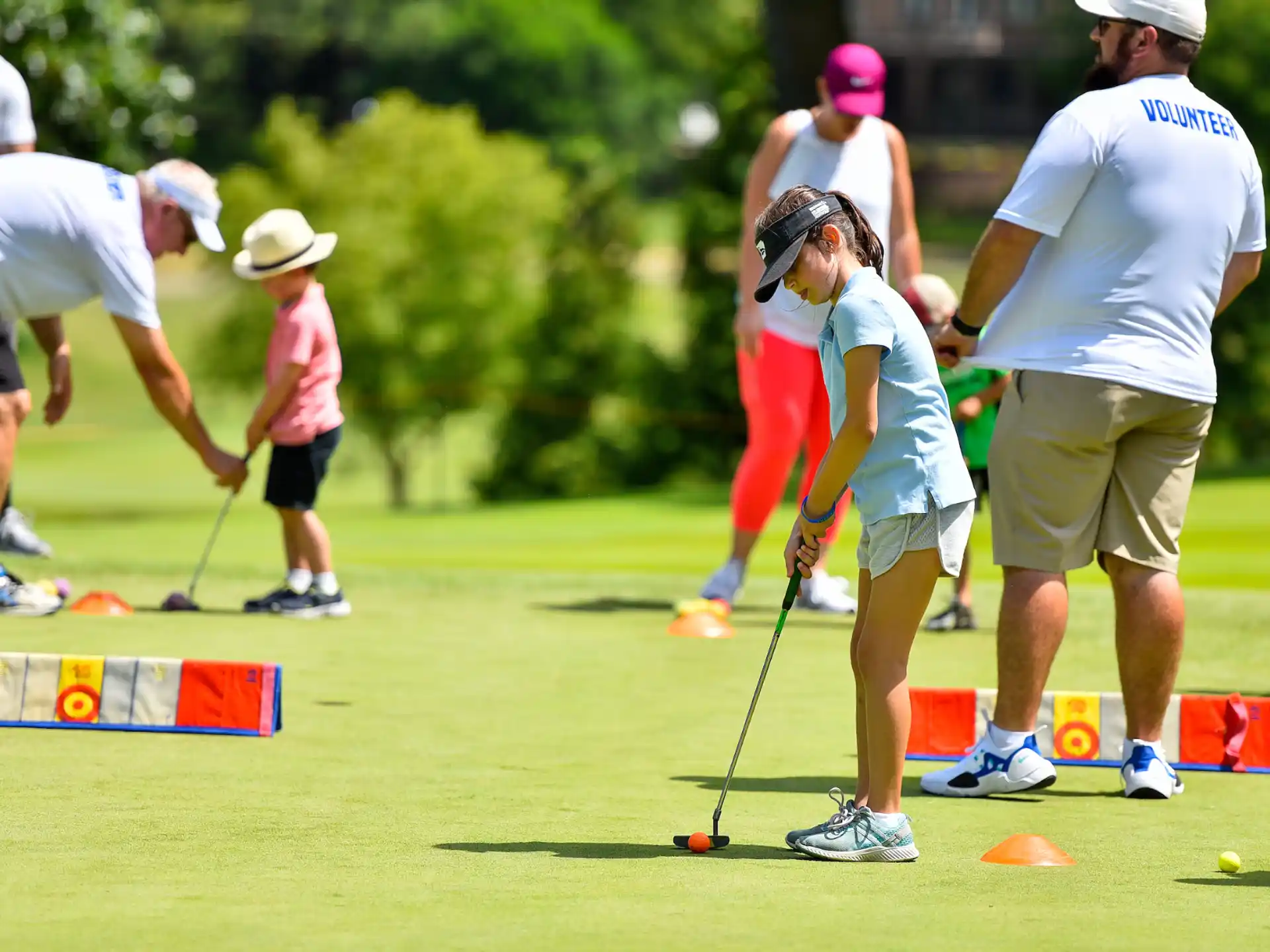 a group of people playing golf