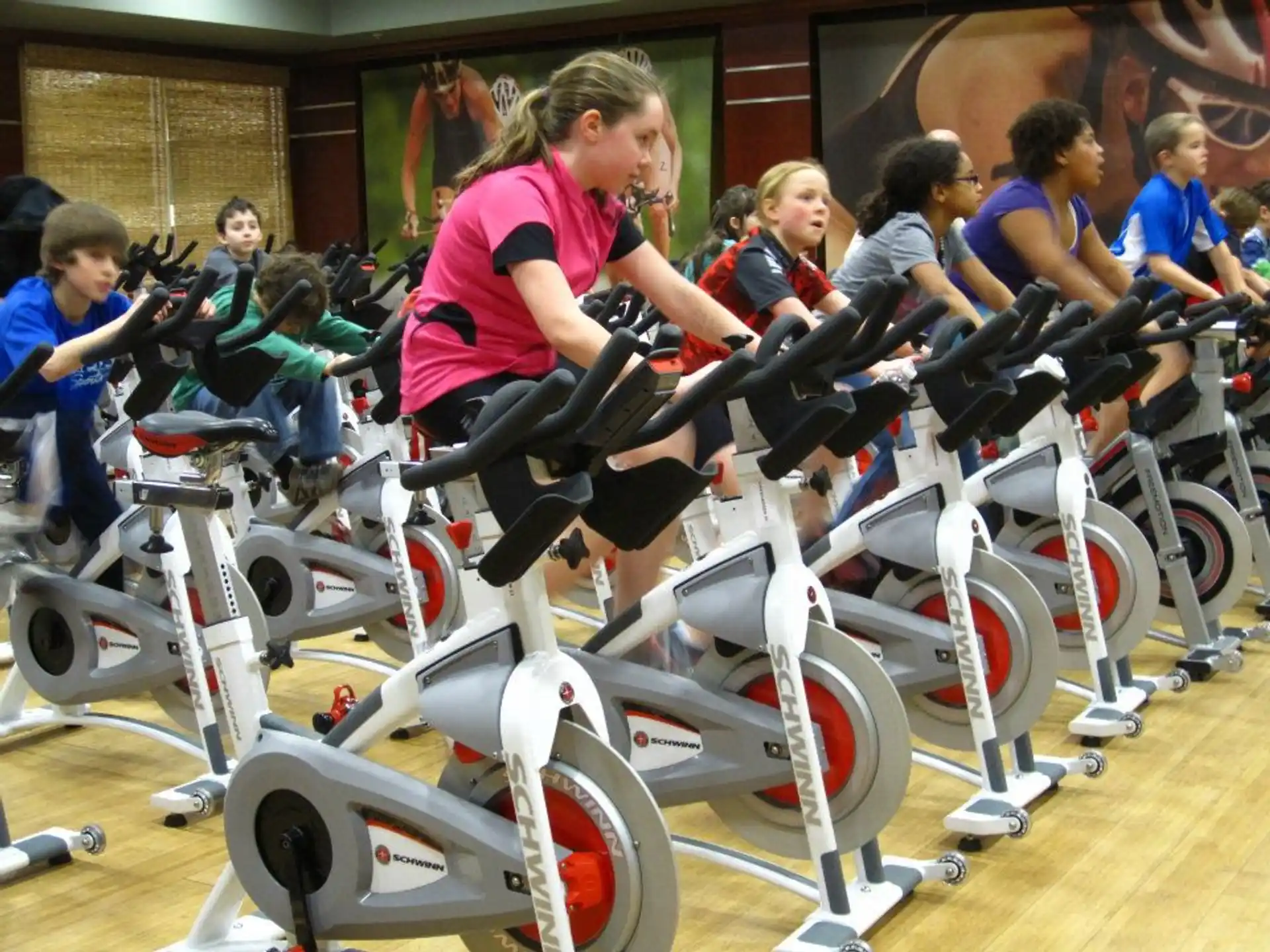 a group of kids working on bicycles