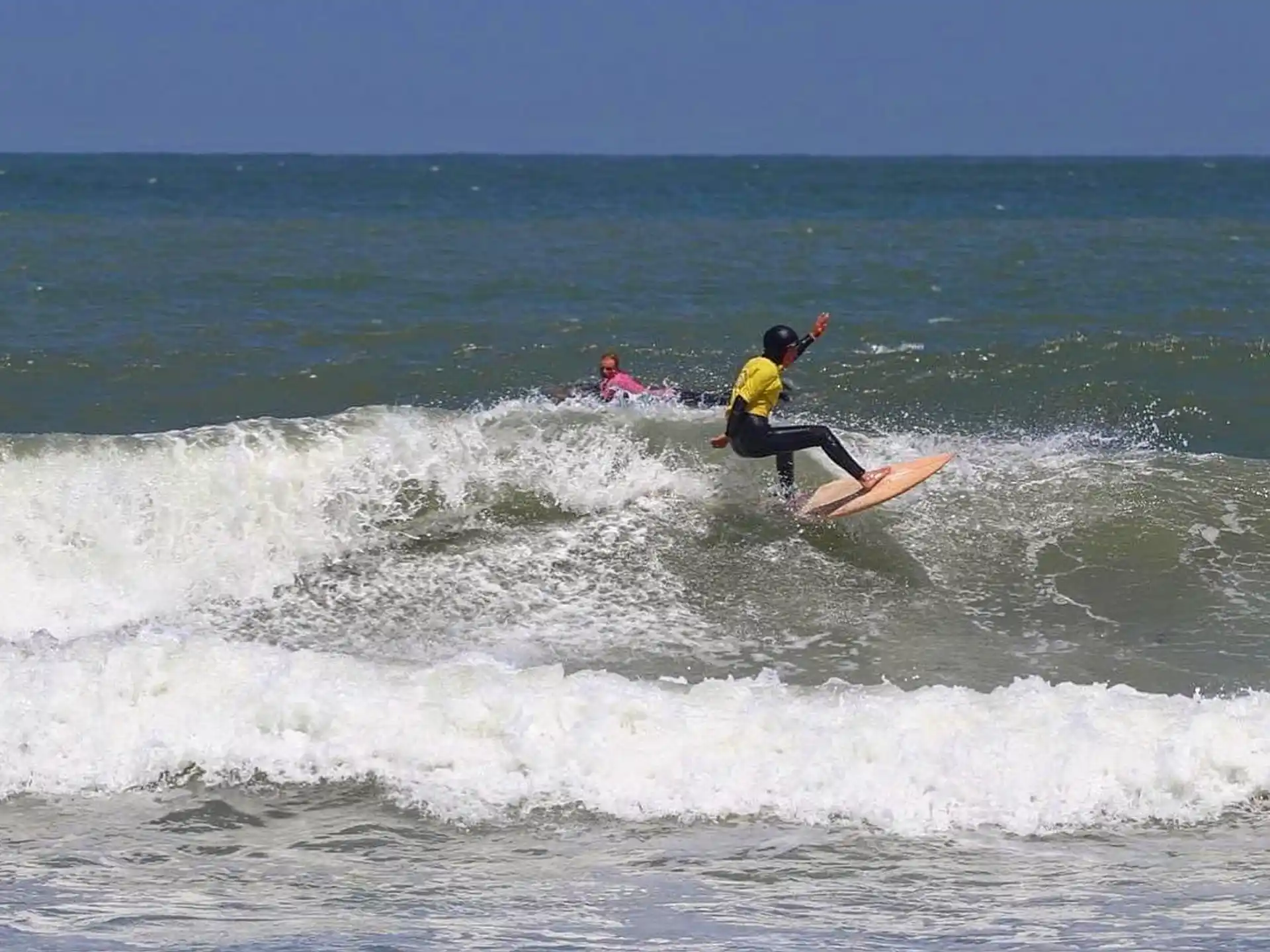 a man surfing on the waves