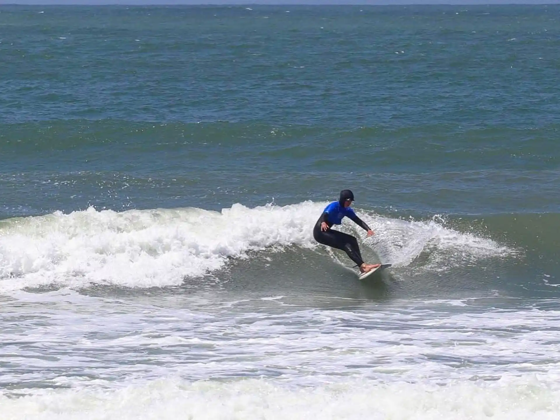 a person surfing on the waves