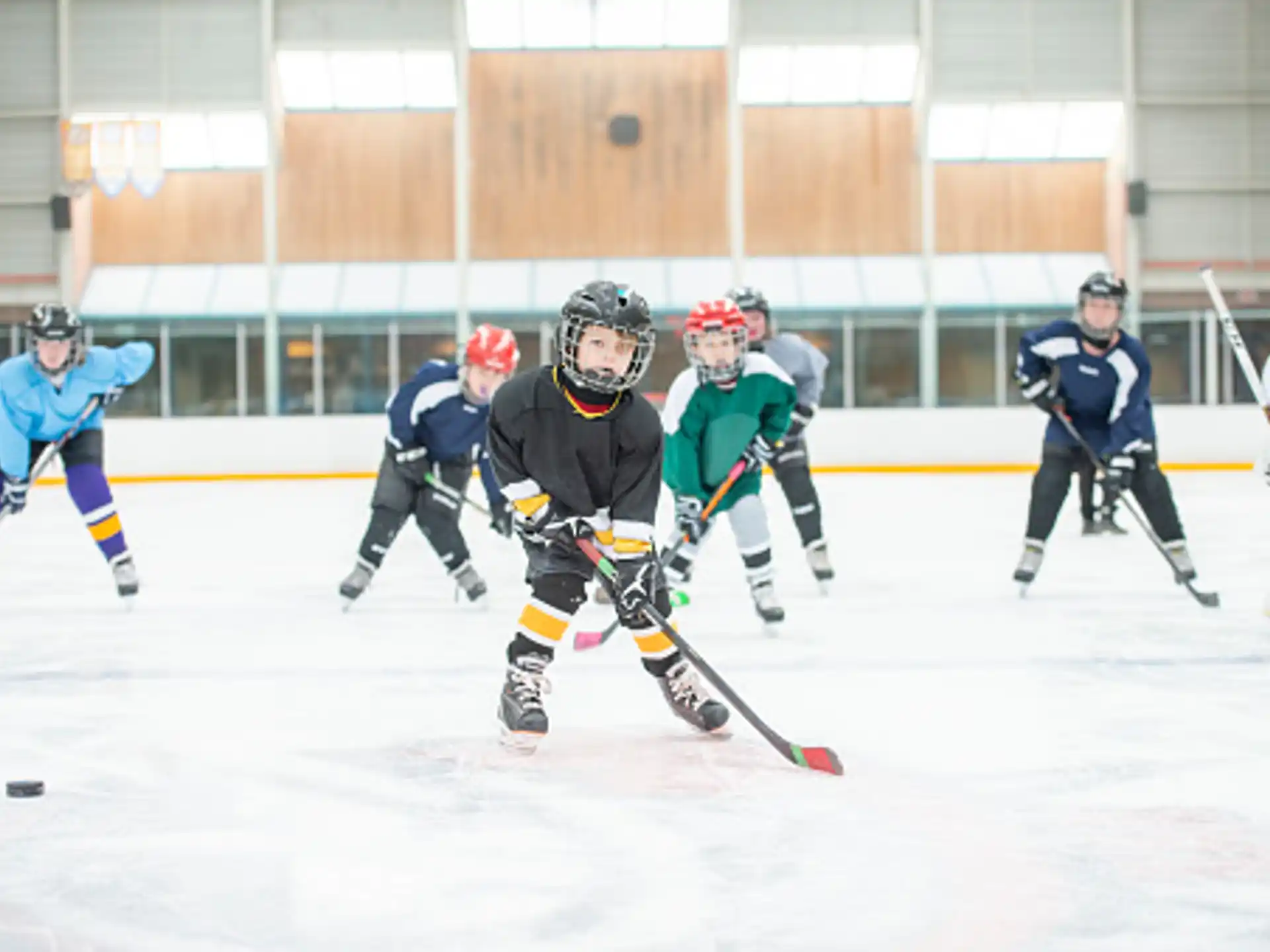 a group of people playing hockey