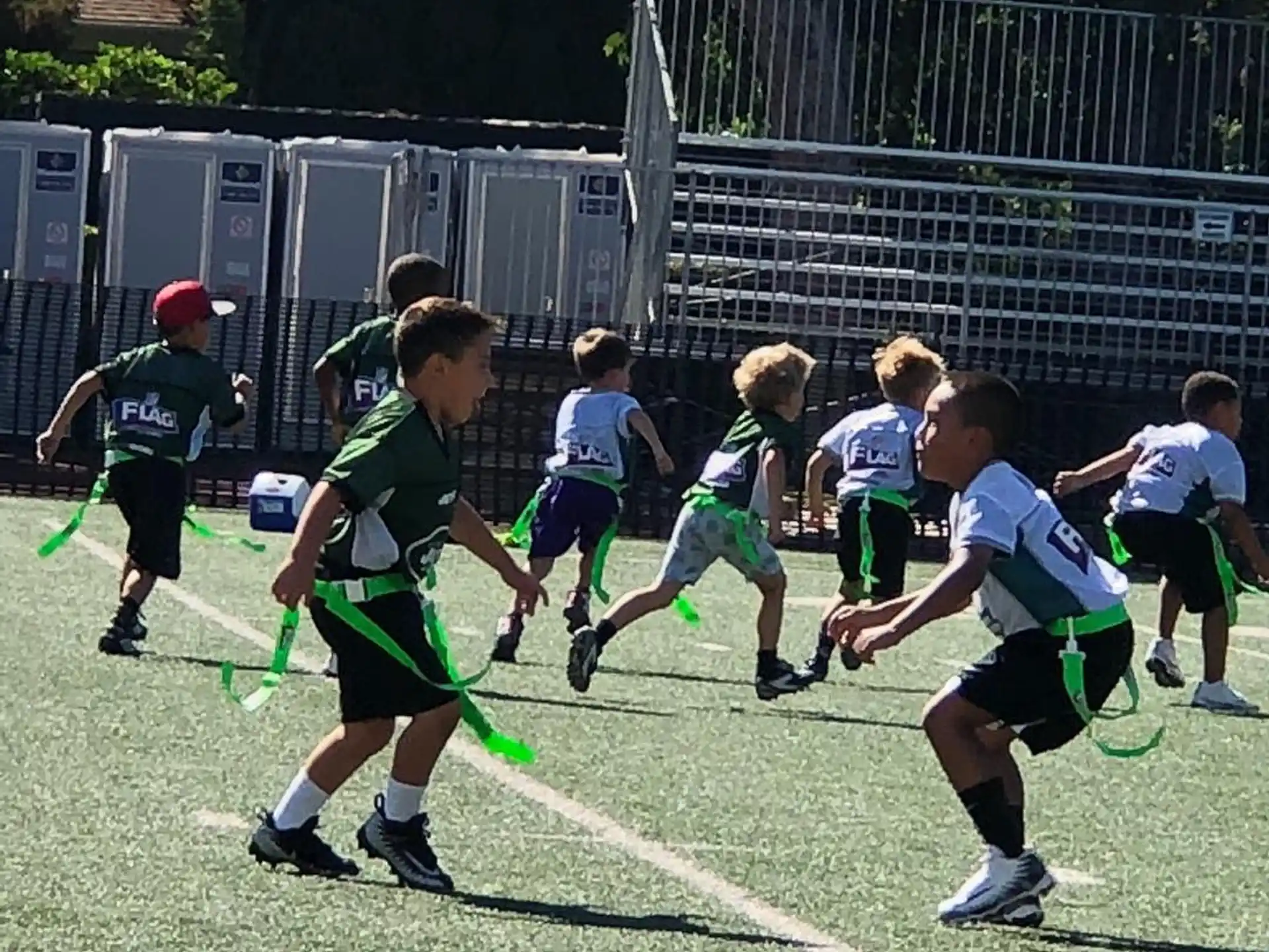 a group of kids playing football