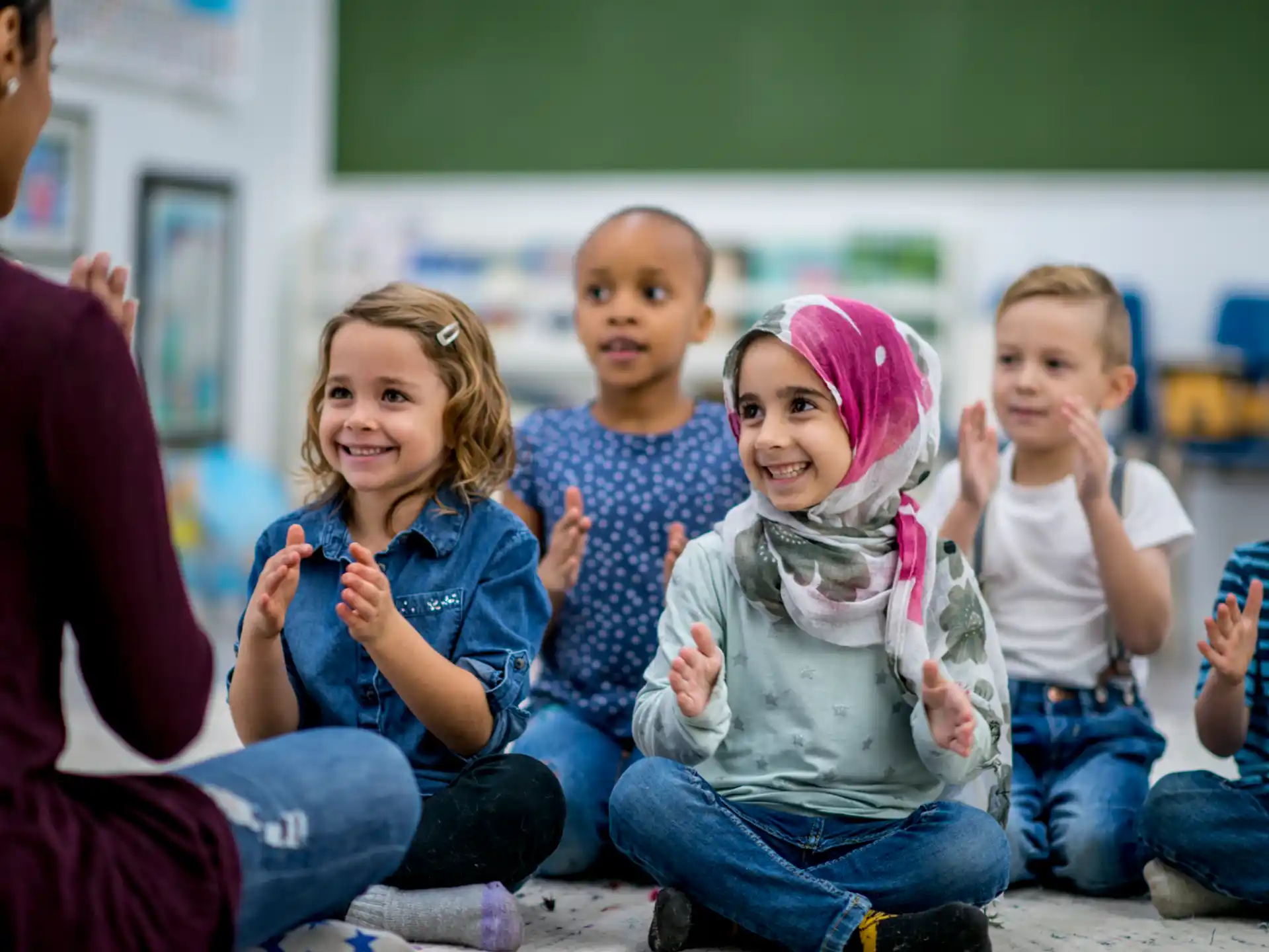 a group of children sitting on the floor