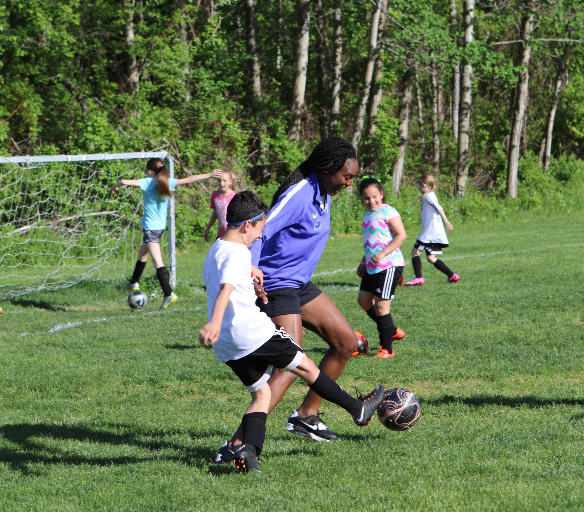 a group of kids playing football