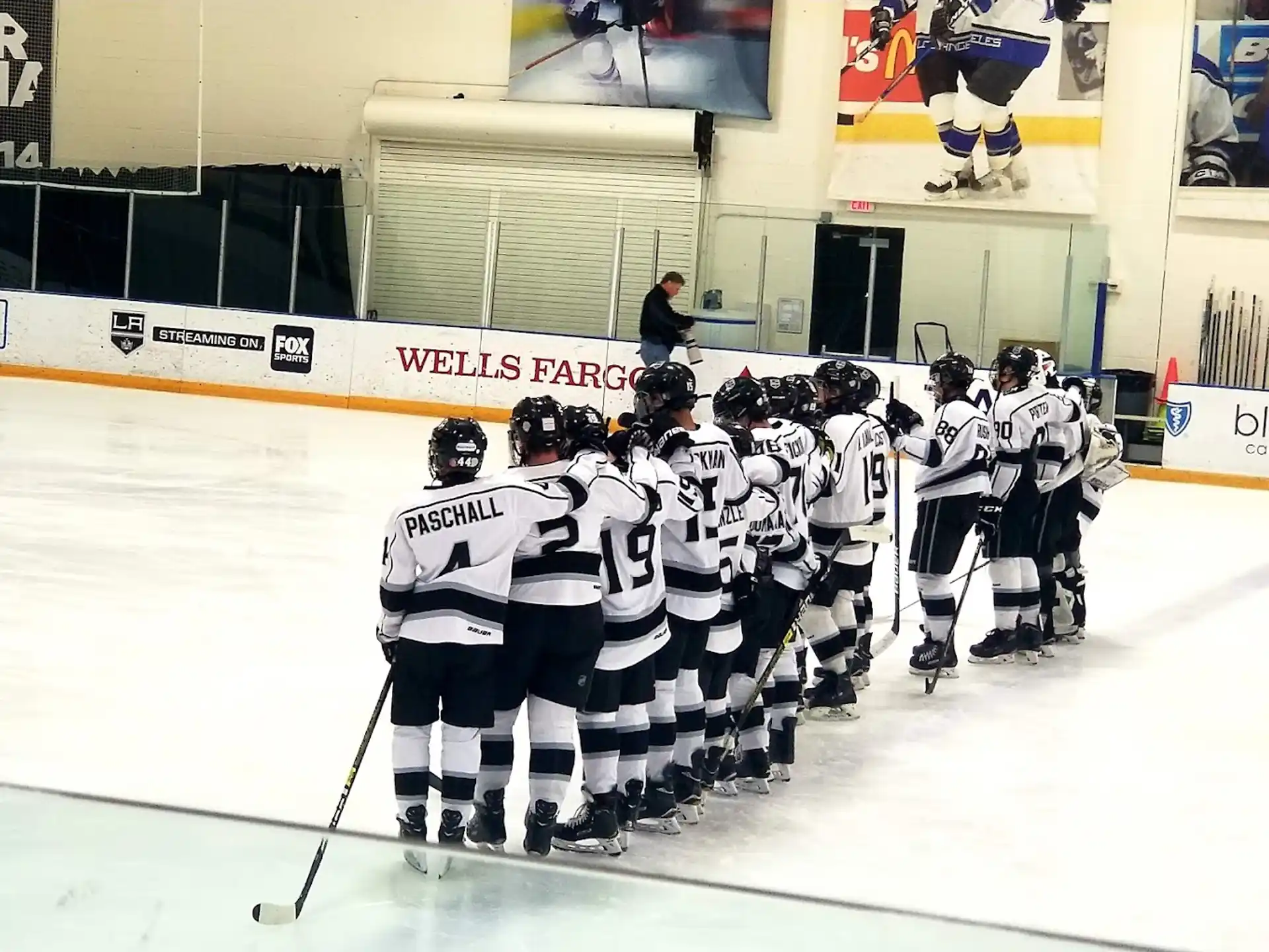 a group of hockey players in uniform