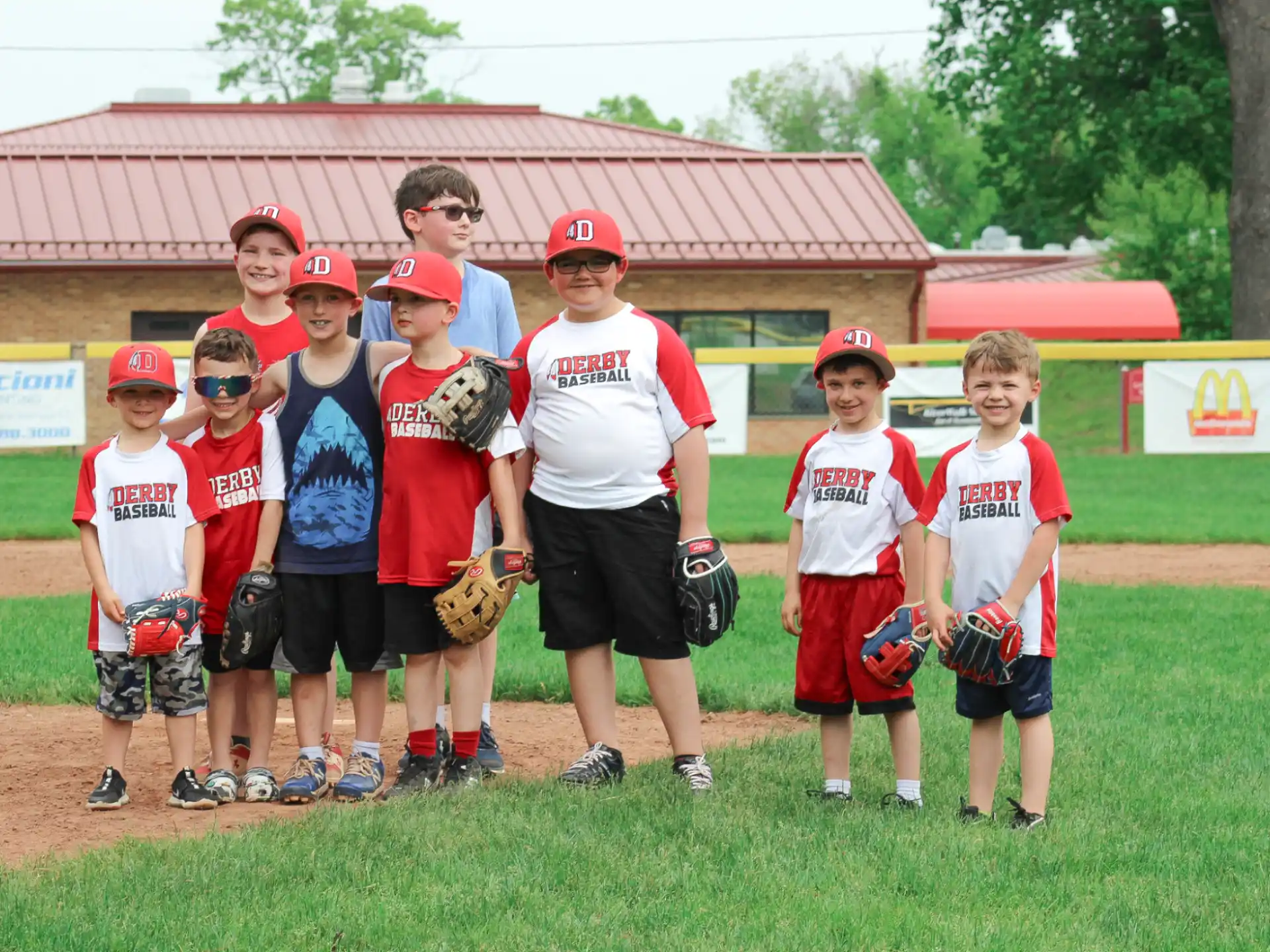 a group of kids pose for a photo