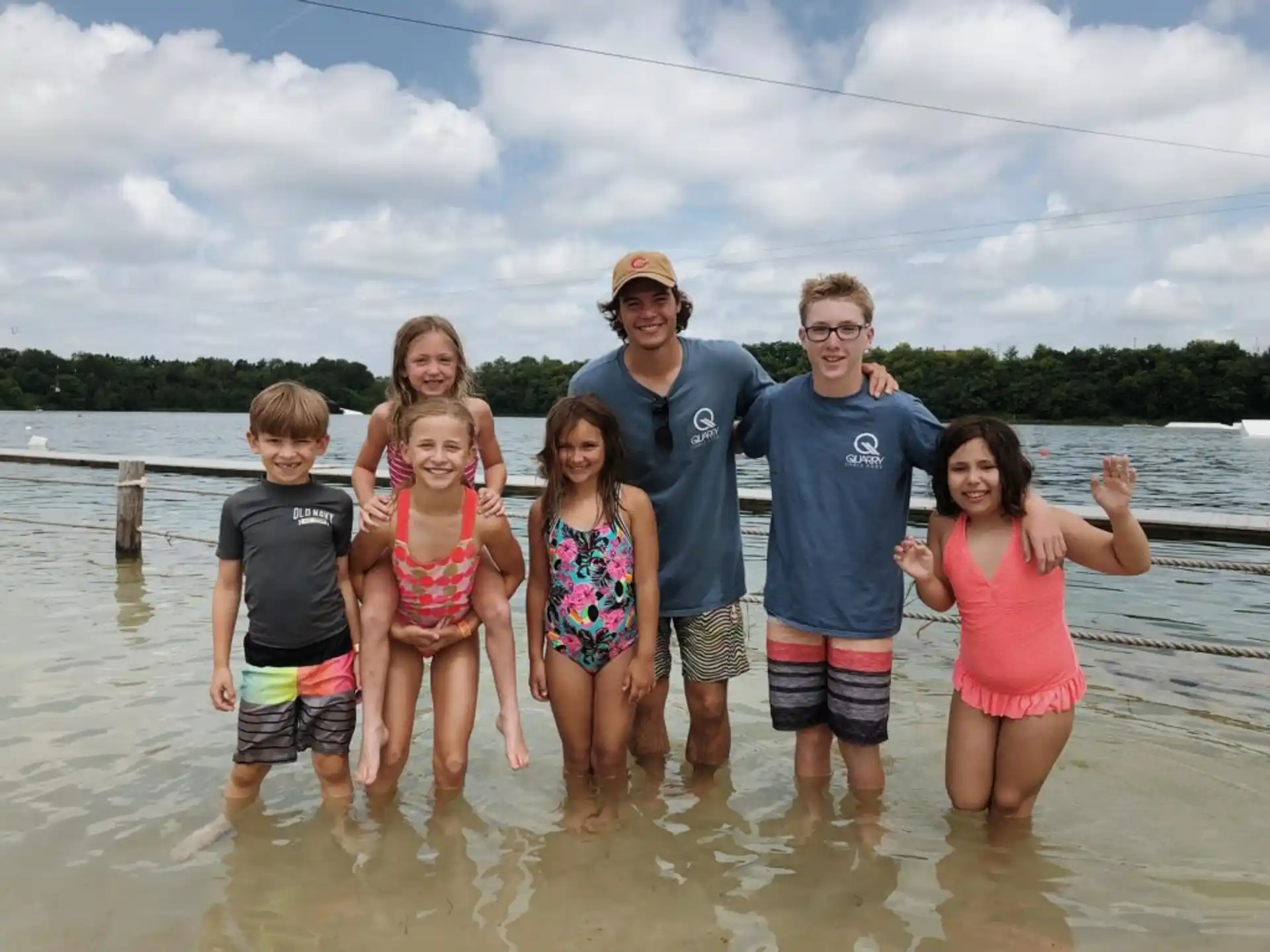 a group of people standing in water