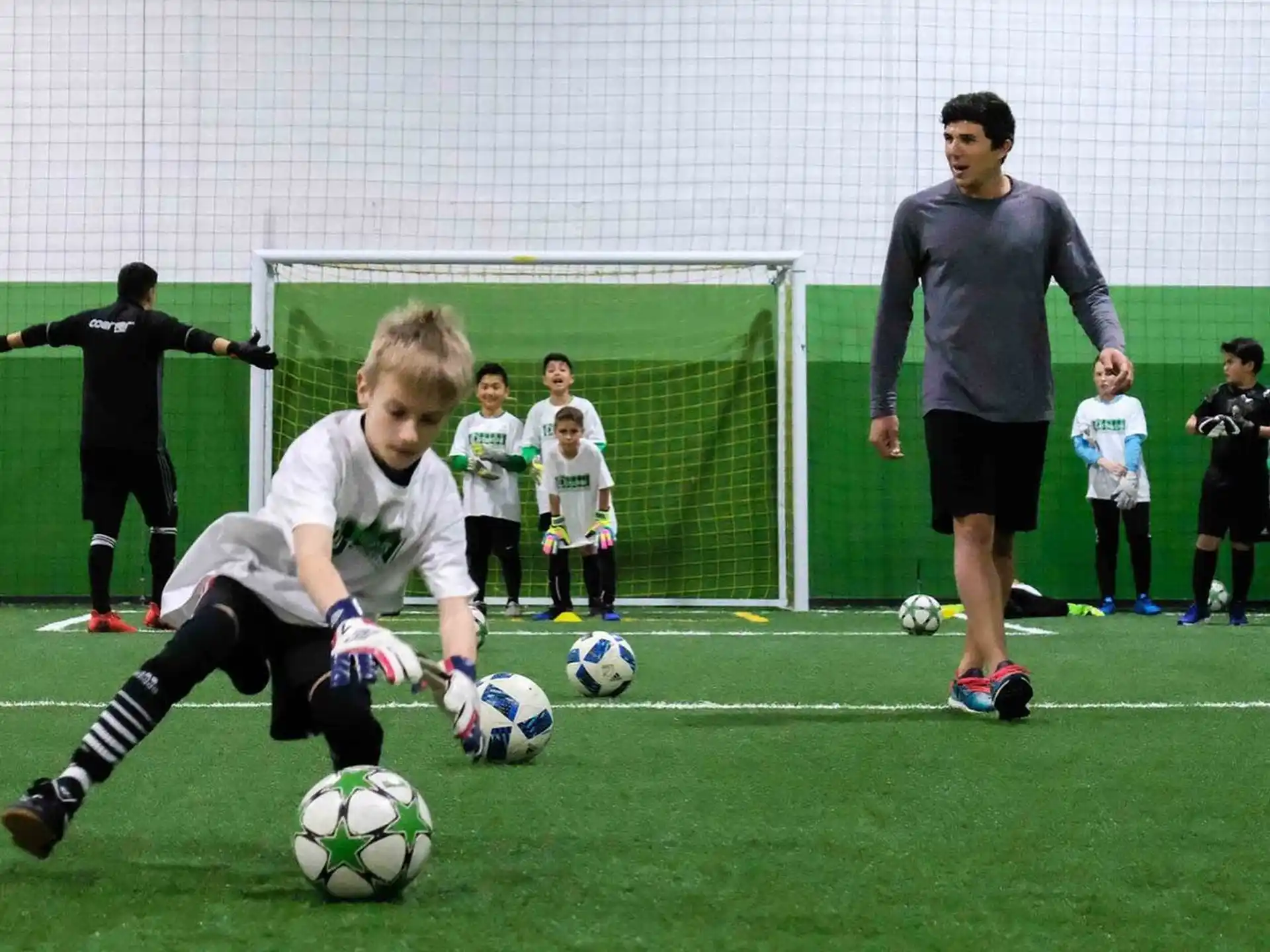 a group of kids playing football