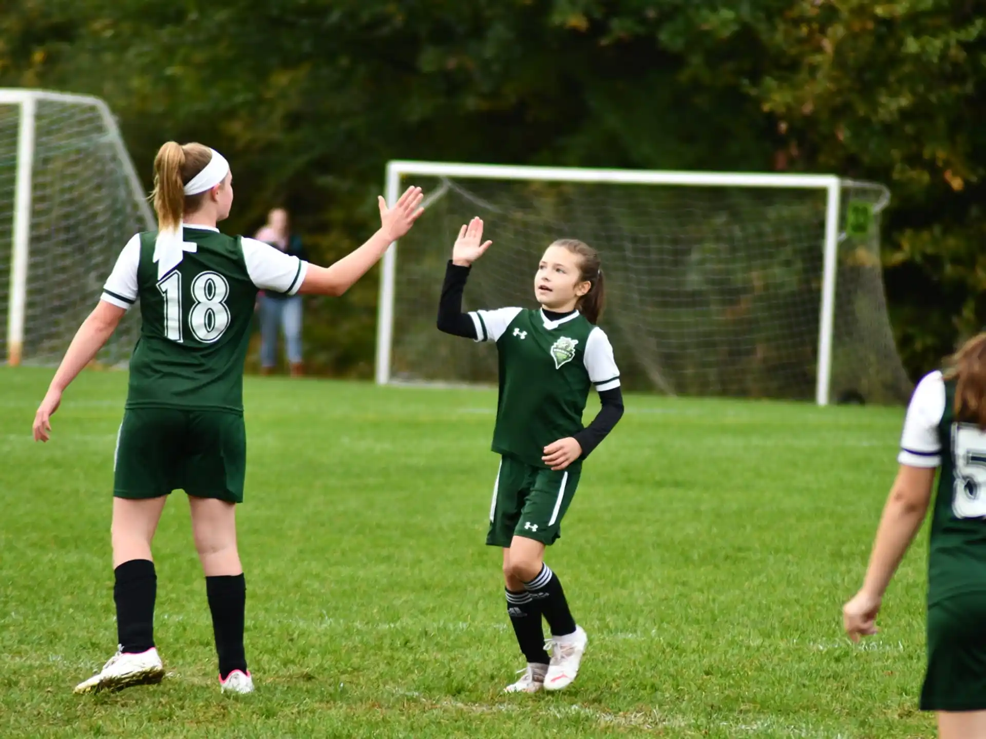 a group of girls playing football