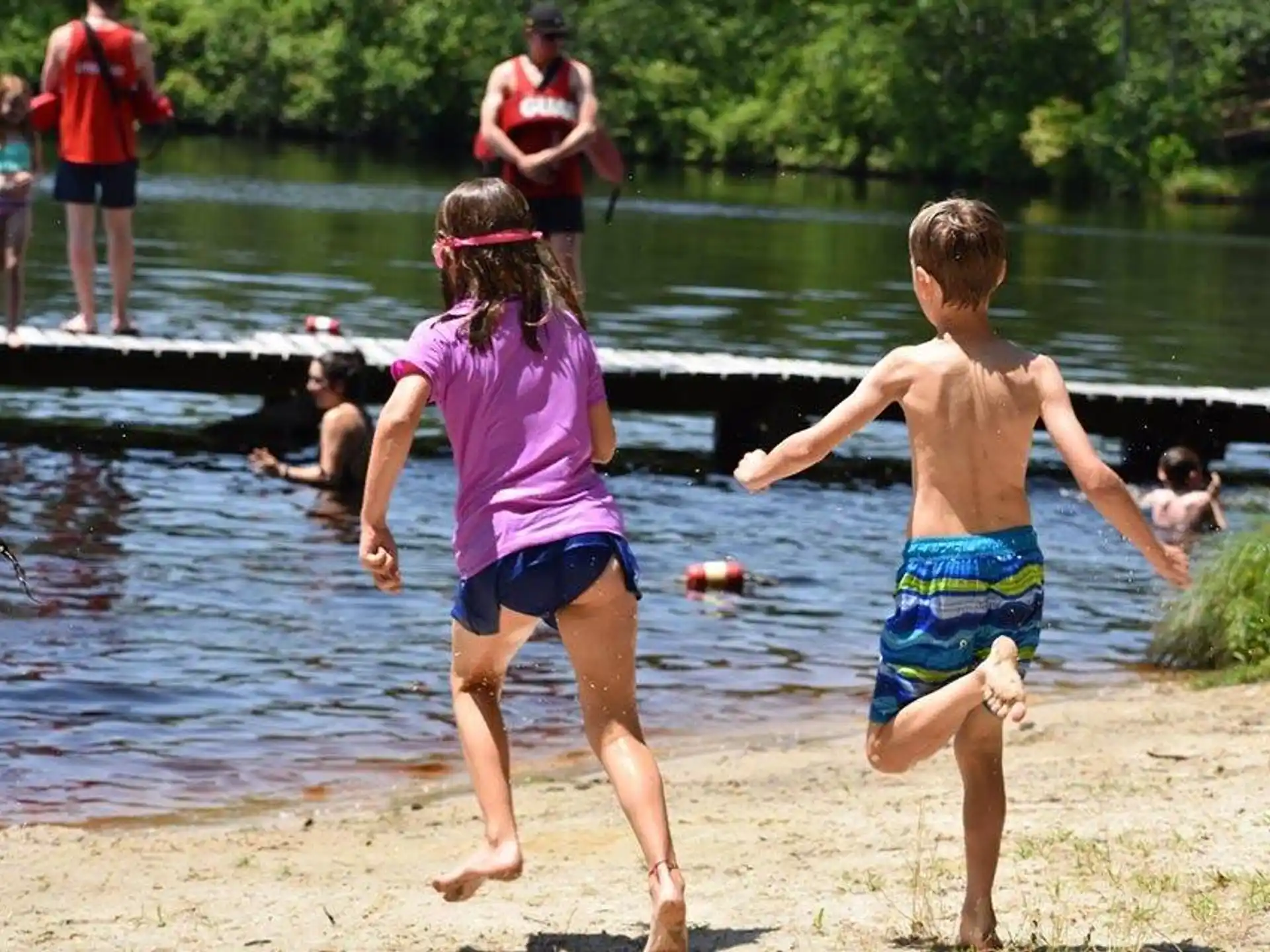 a couple of children playing in the water