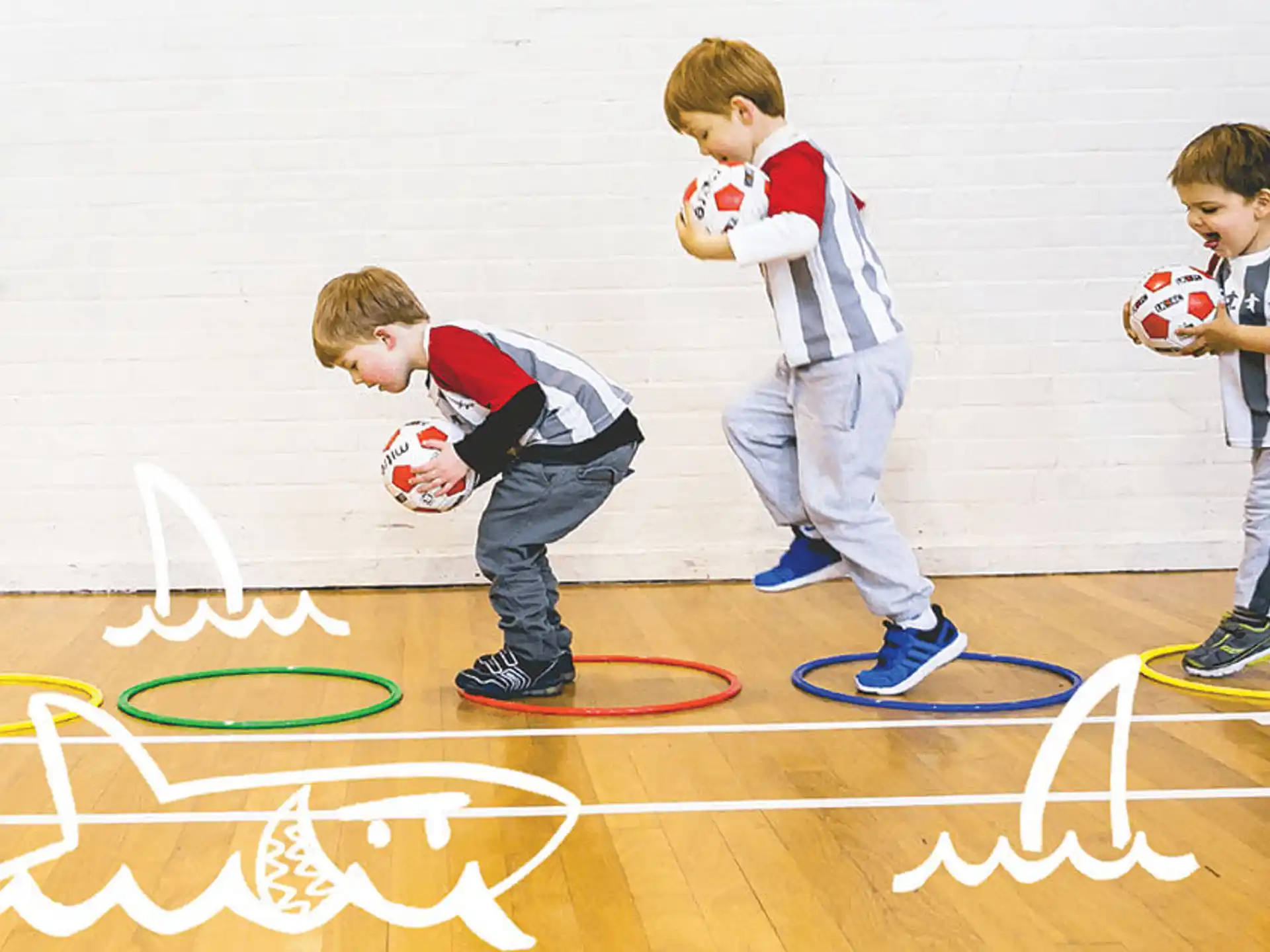 a group of boys playing basketball