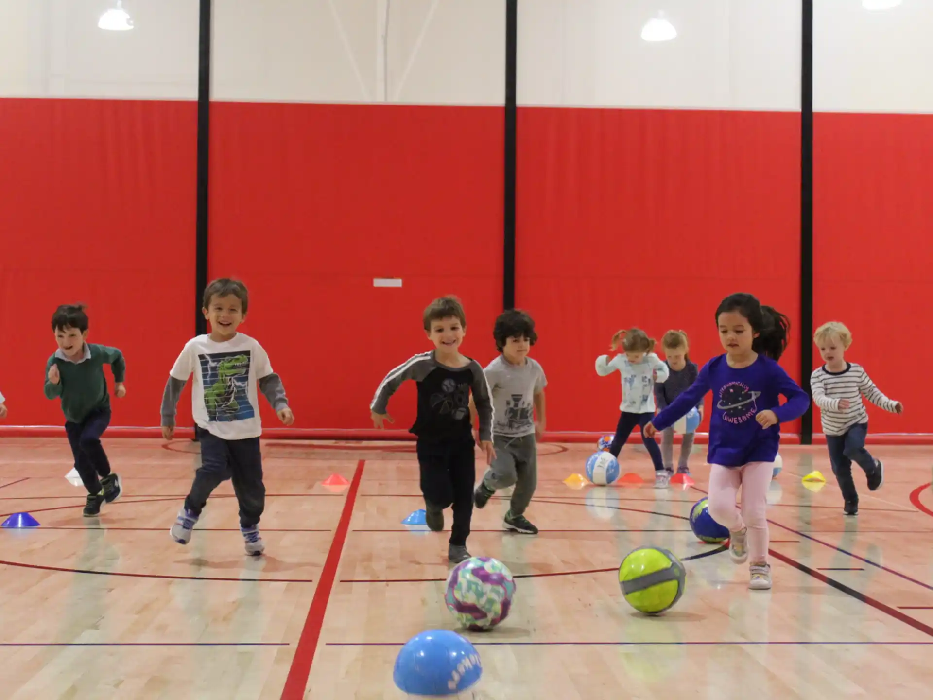 kids playing with football balls