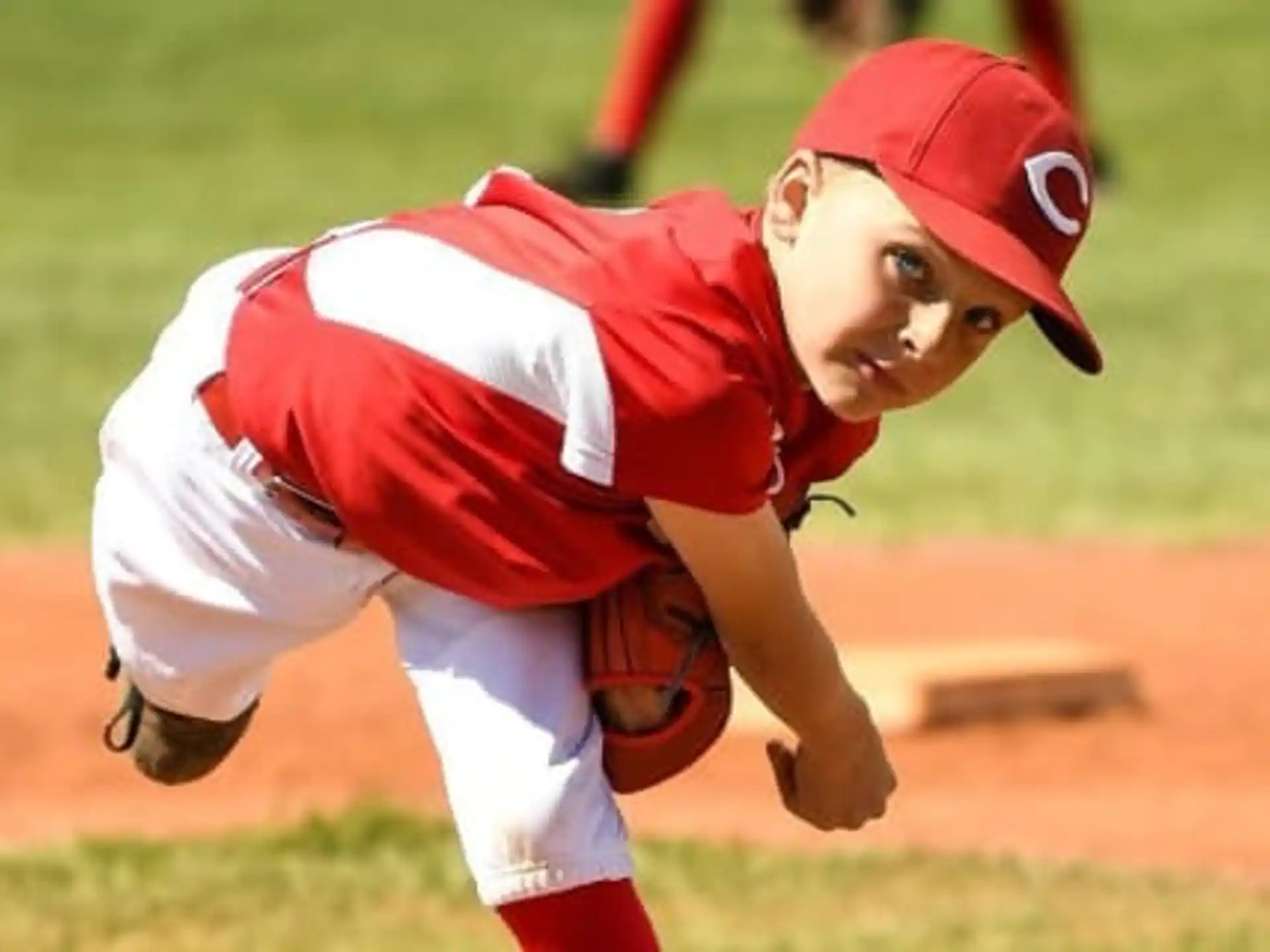 a baseball player in a red uniform