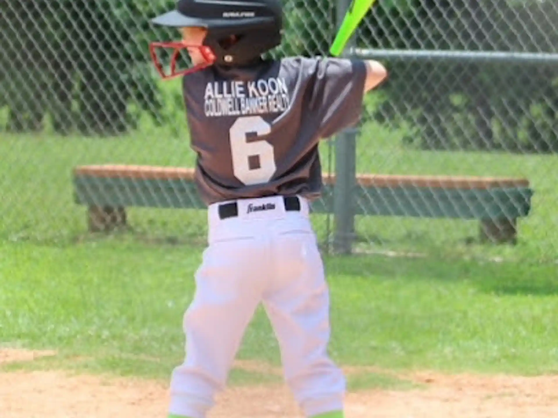 a young boy playing baseball