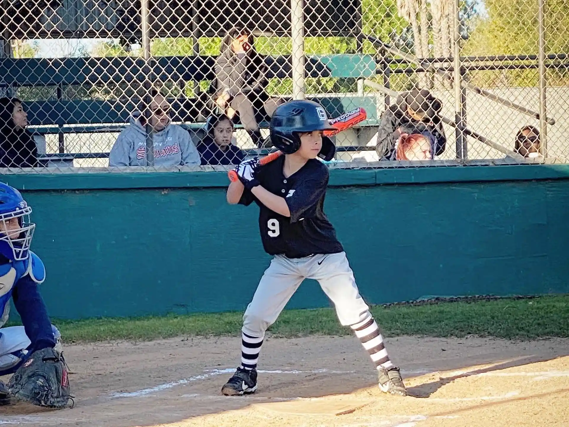 a kid swinging a baseball bat