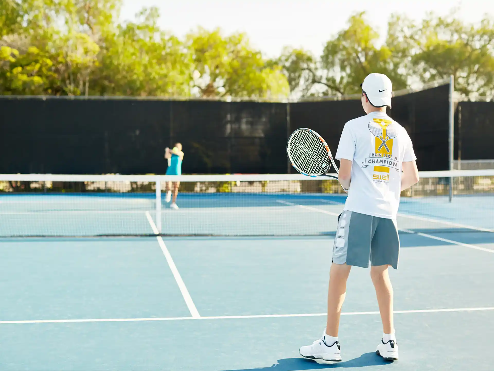 a man holding a tennis racket