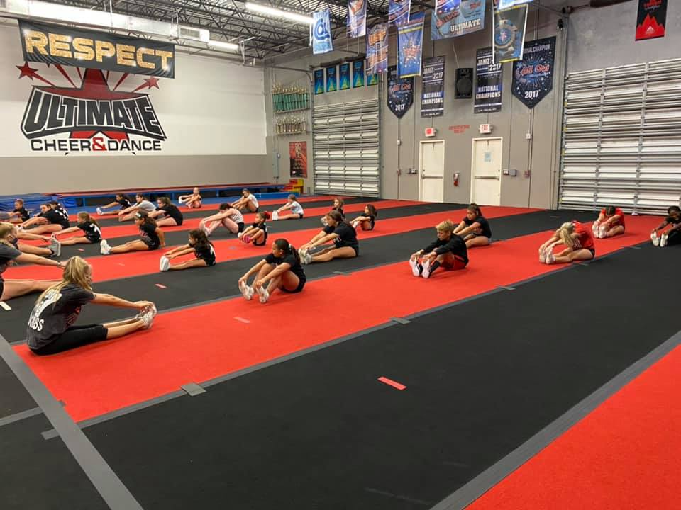 a group of people sitting on the floor in a room
