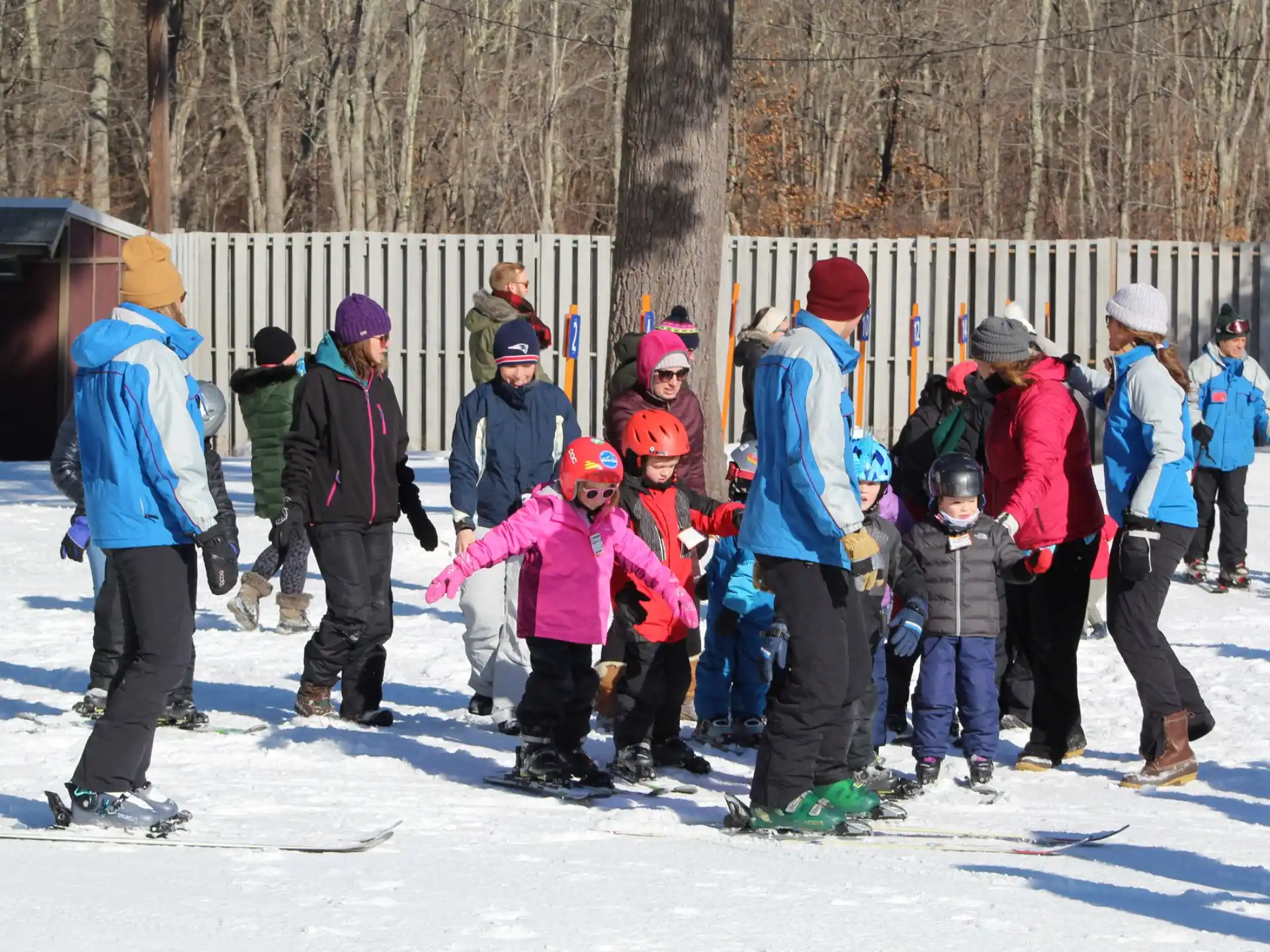 a group of people standing in the snow