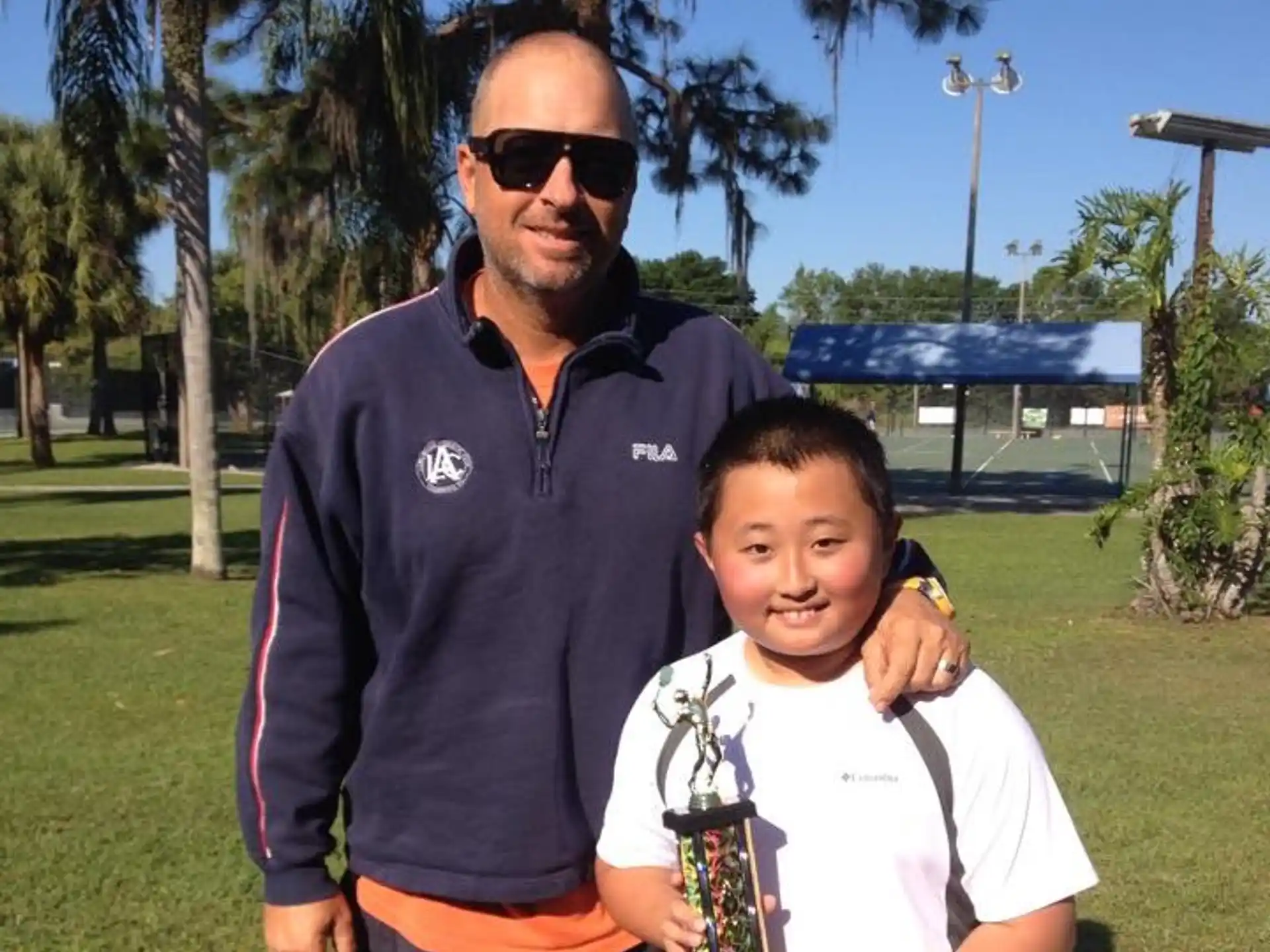 a man and a boy posing for a picture