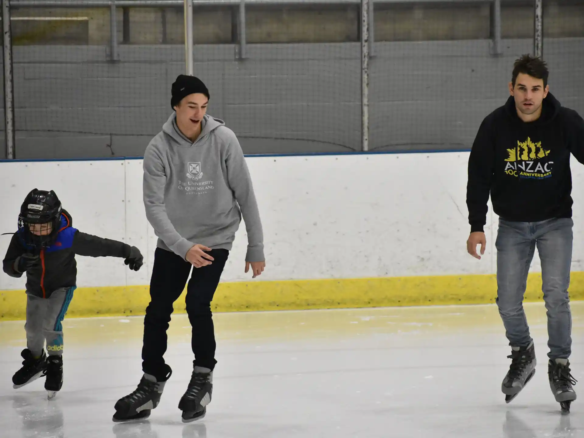 a person and a boy ice skating