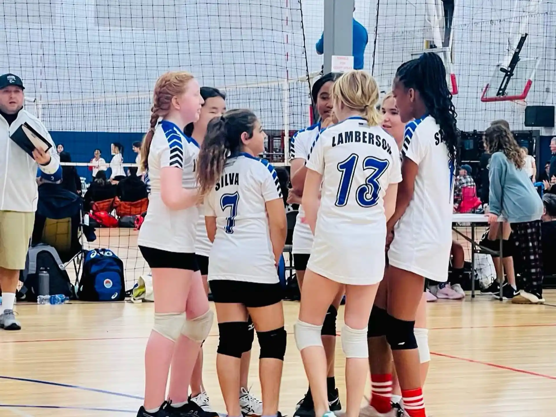 a group of girls in white uniforms