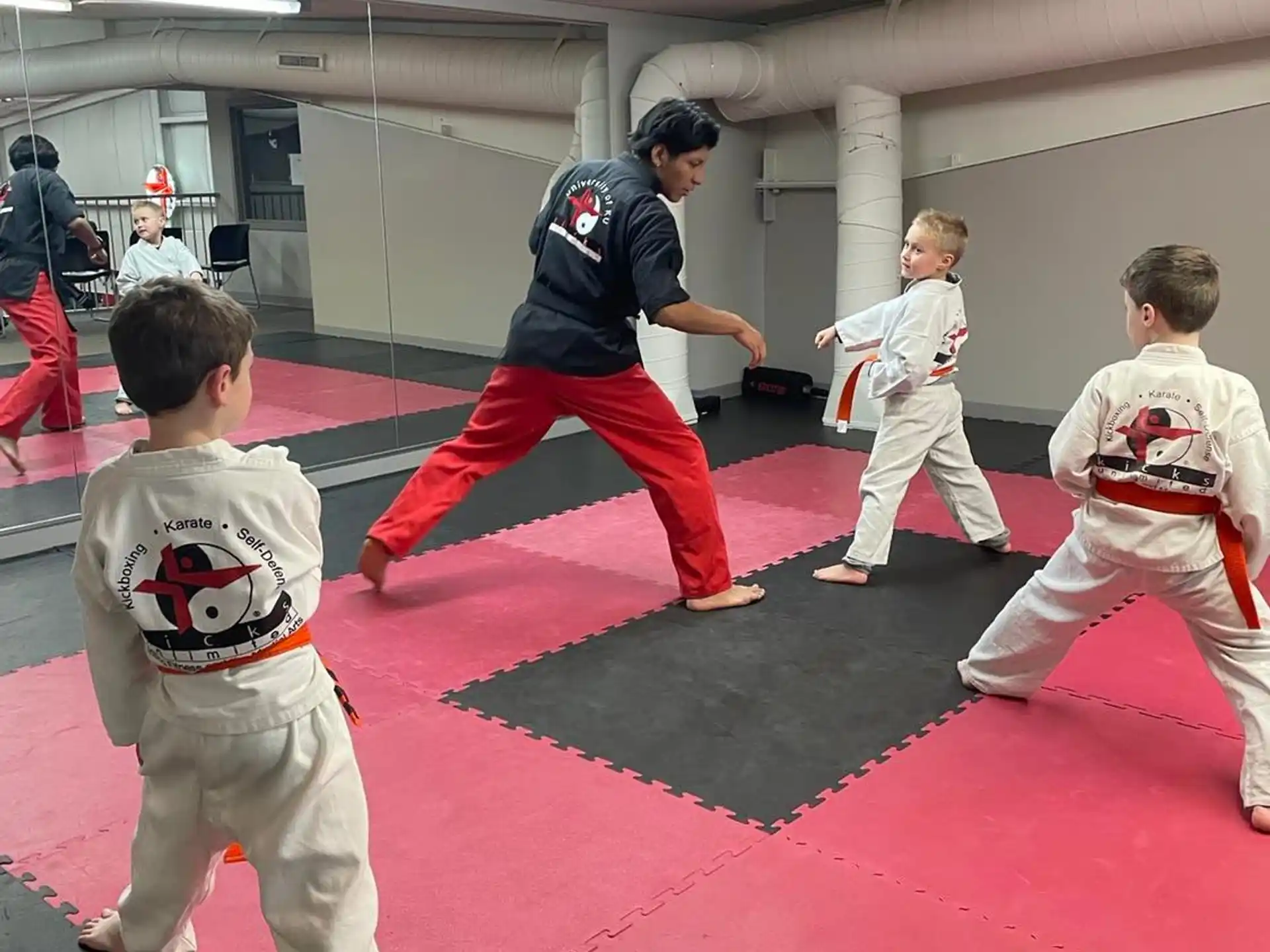 a group of people in karate uniforms