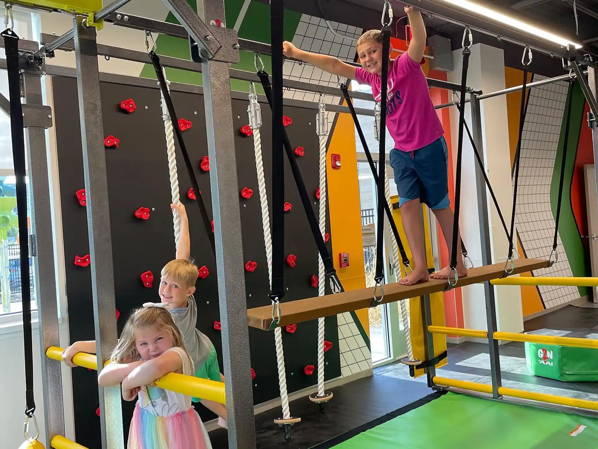 a person and two children on a playground
