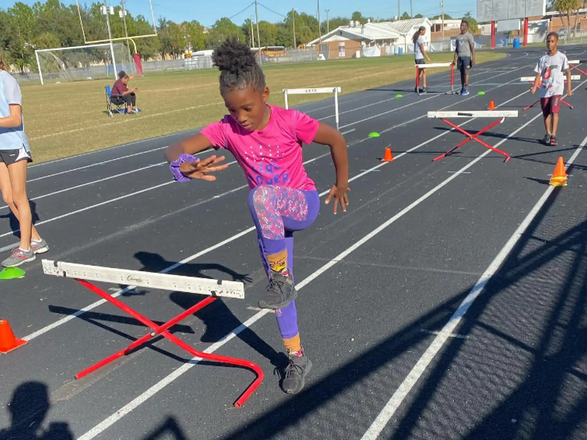 a girl running on a track