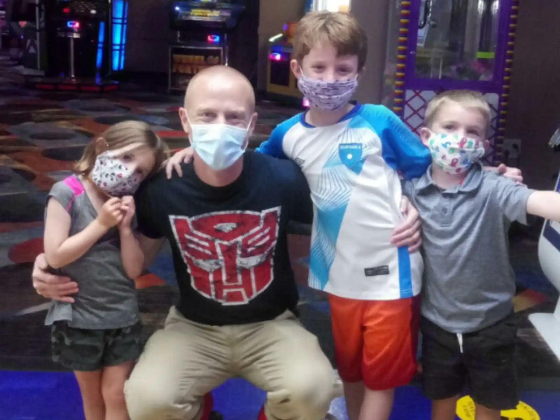 a group of kids wearing face masks