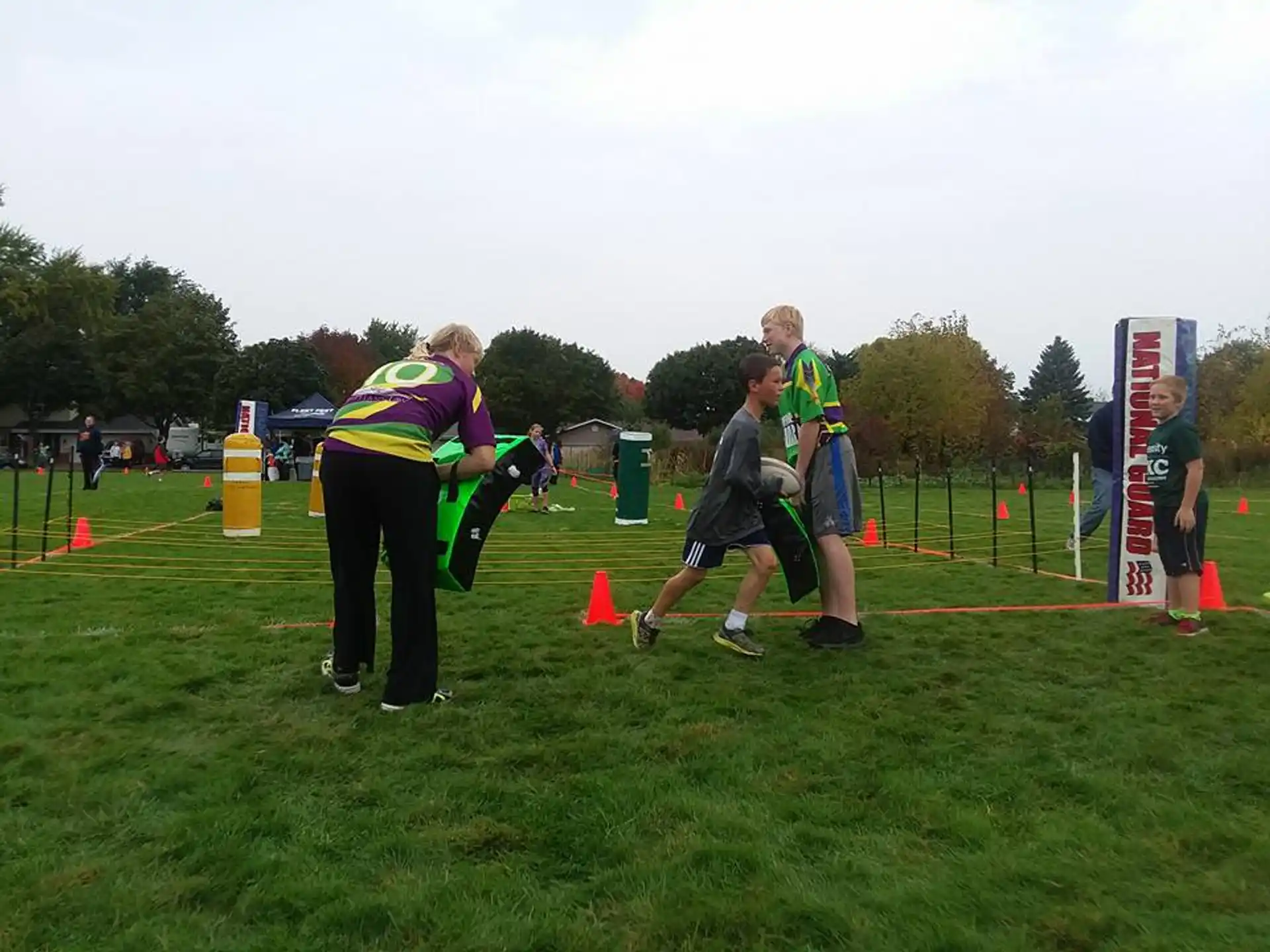 a group of people playing football