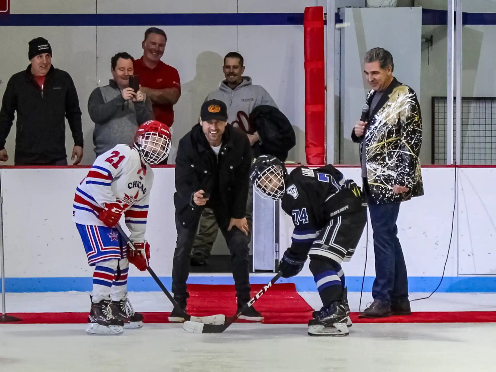 a group of people watching a hockey game