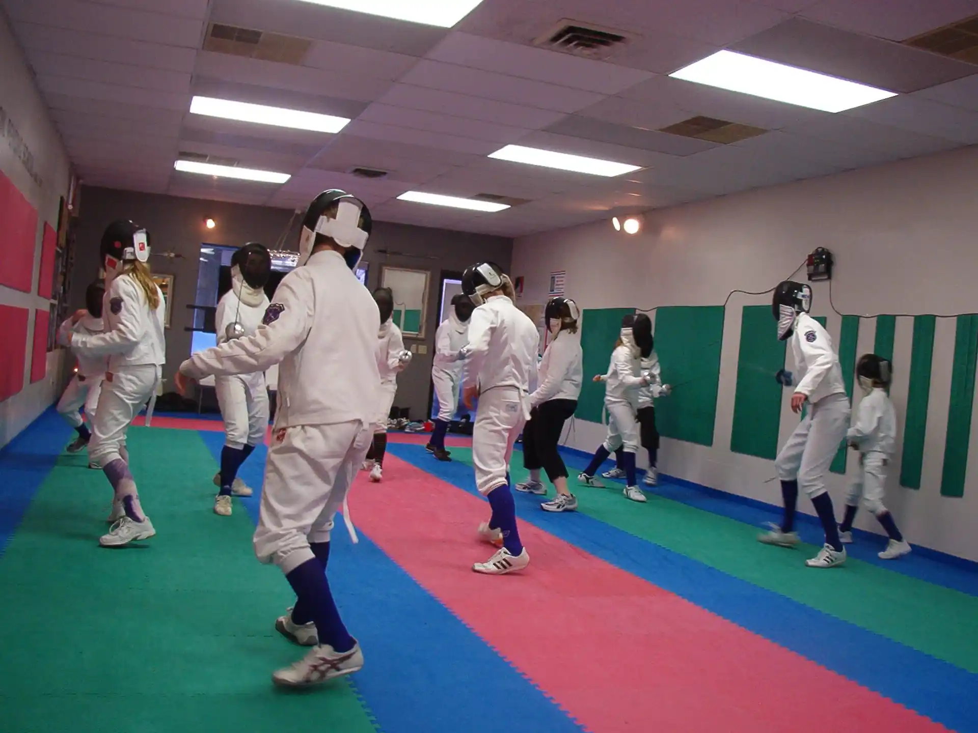 a group of people wearing white outfits