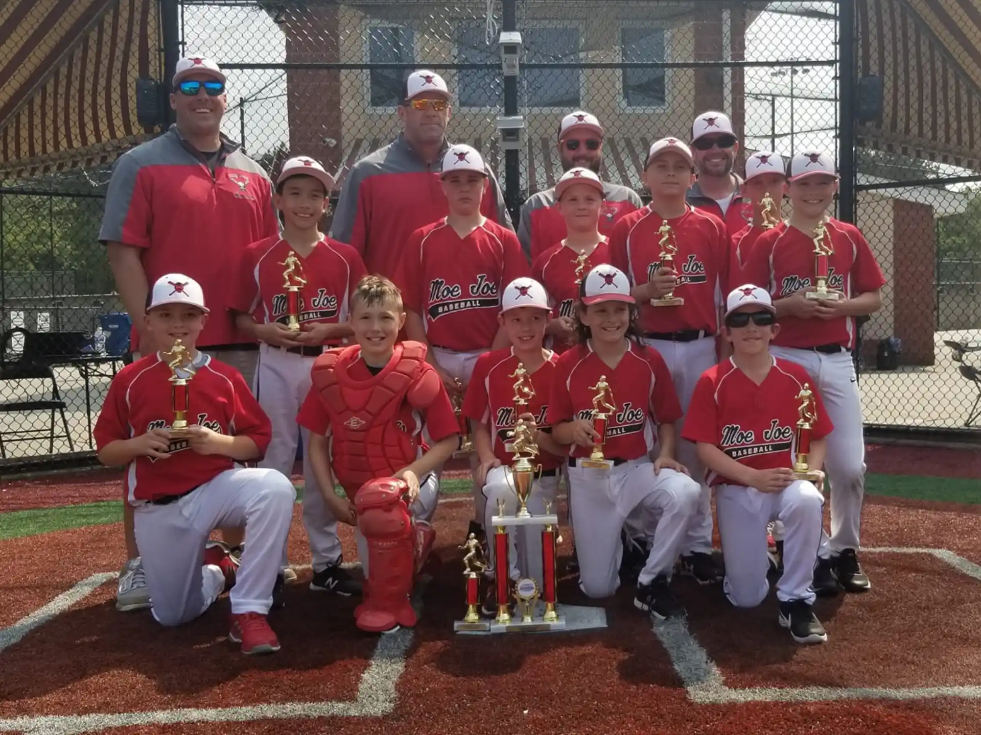 a group of baseball players posing for a photo