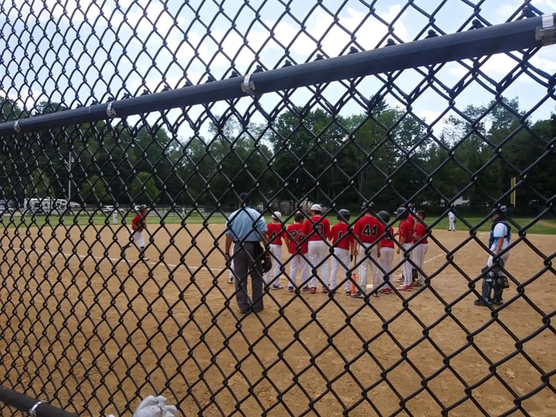 a group of people playing baseball