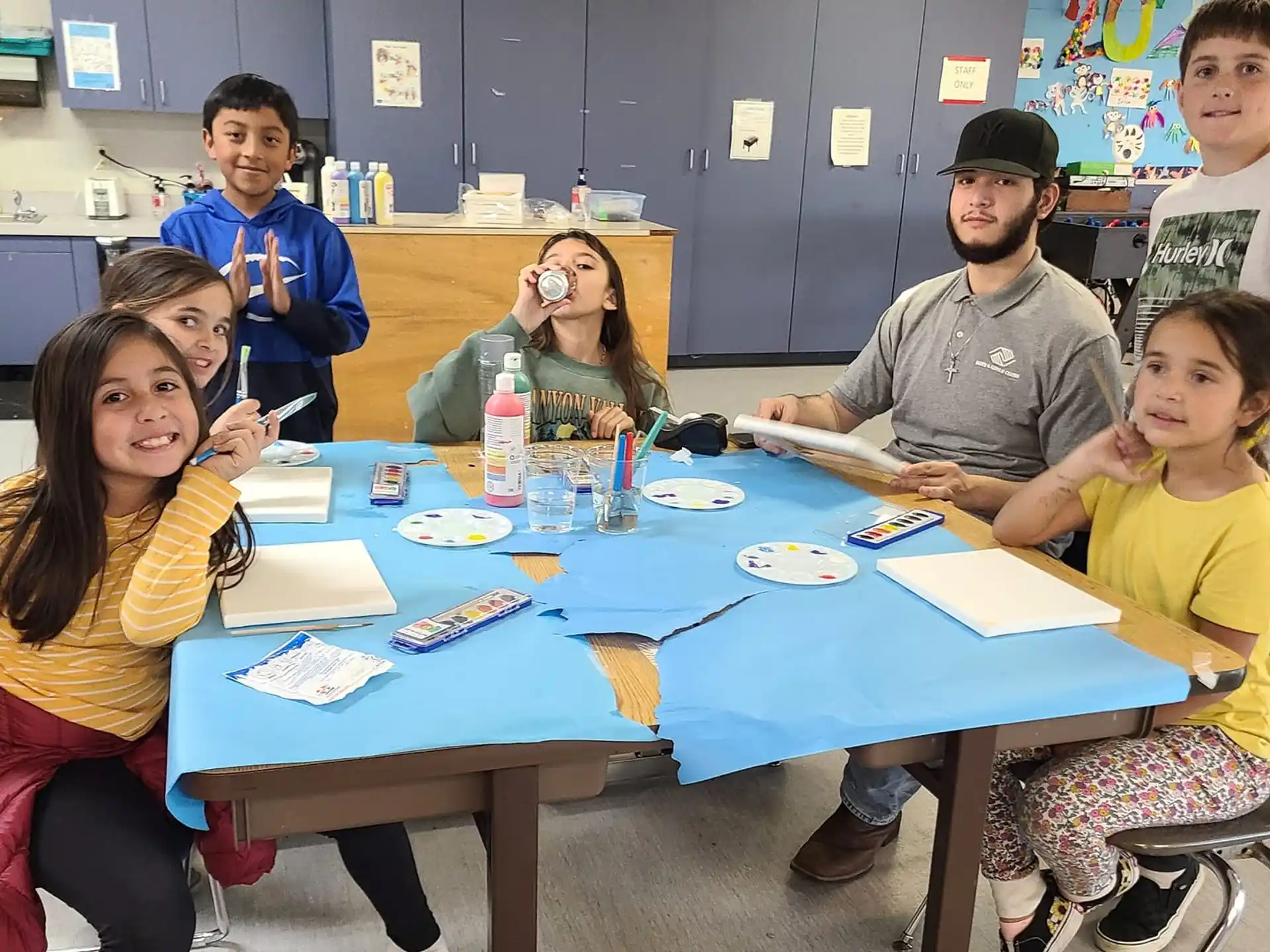 a group of people sitting around a table