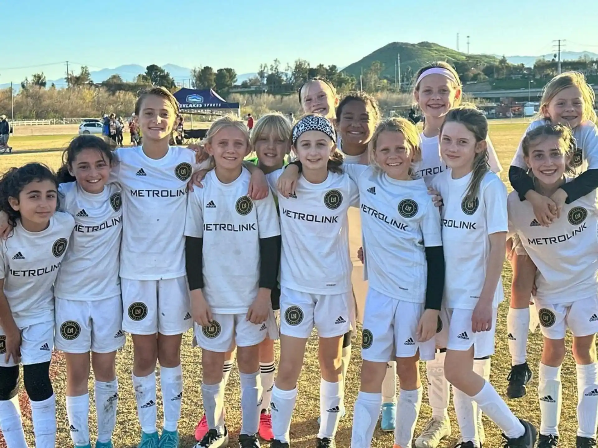 a group of girls in white uniforms