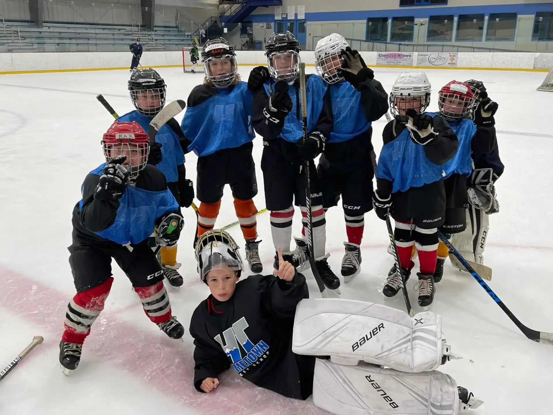 a group of hockey players posing for a photo