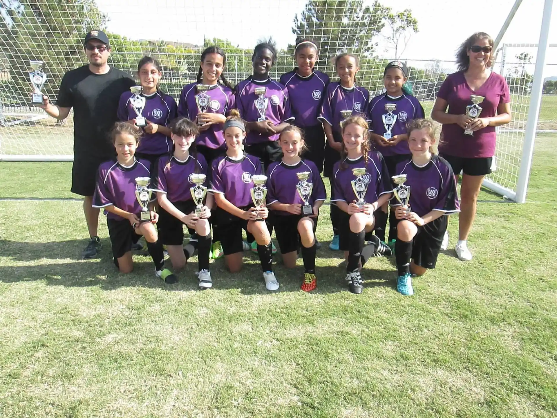 a group of people in purple uniforms