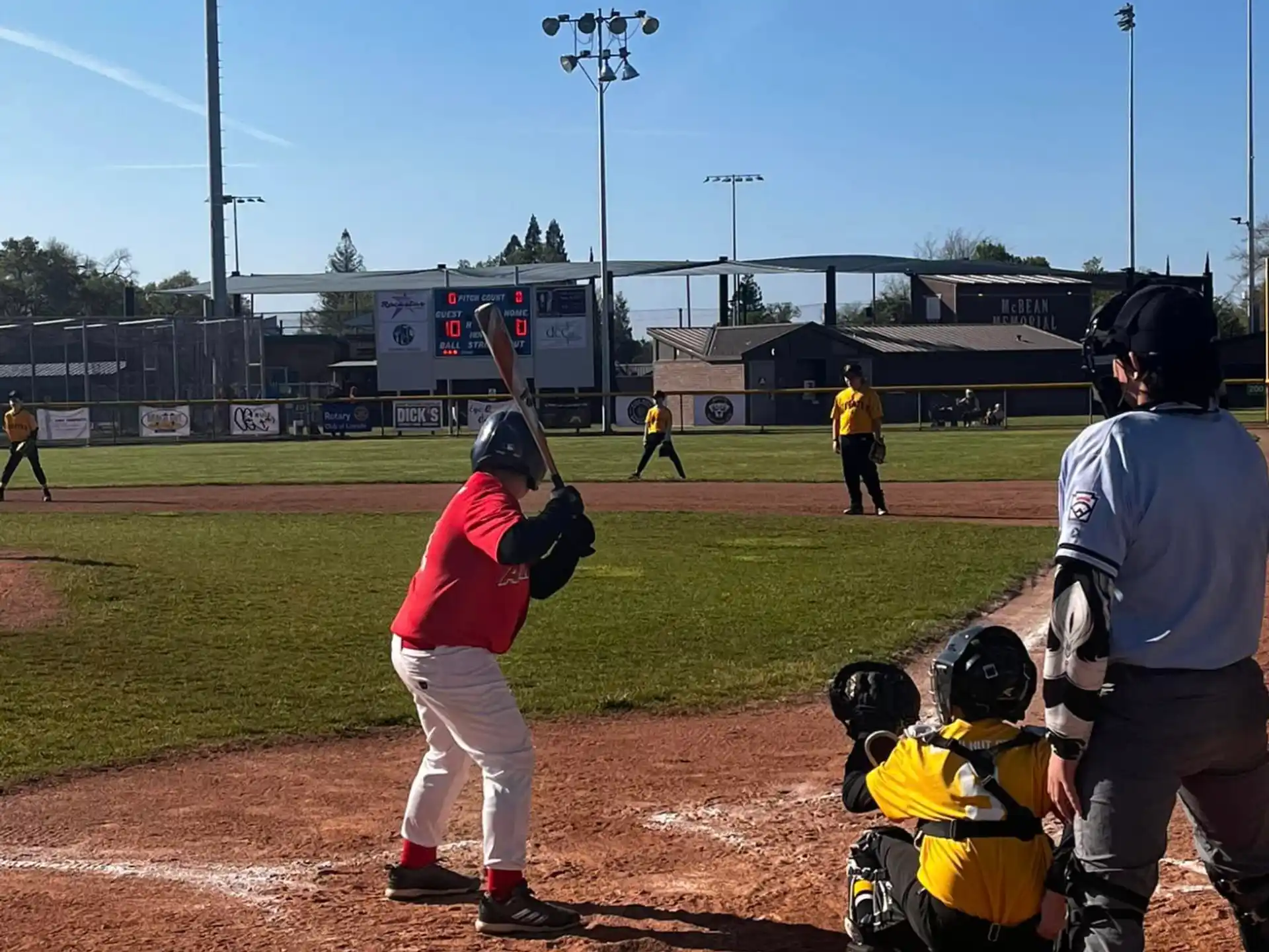 a baseball player prepares to swing a bat
