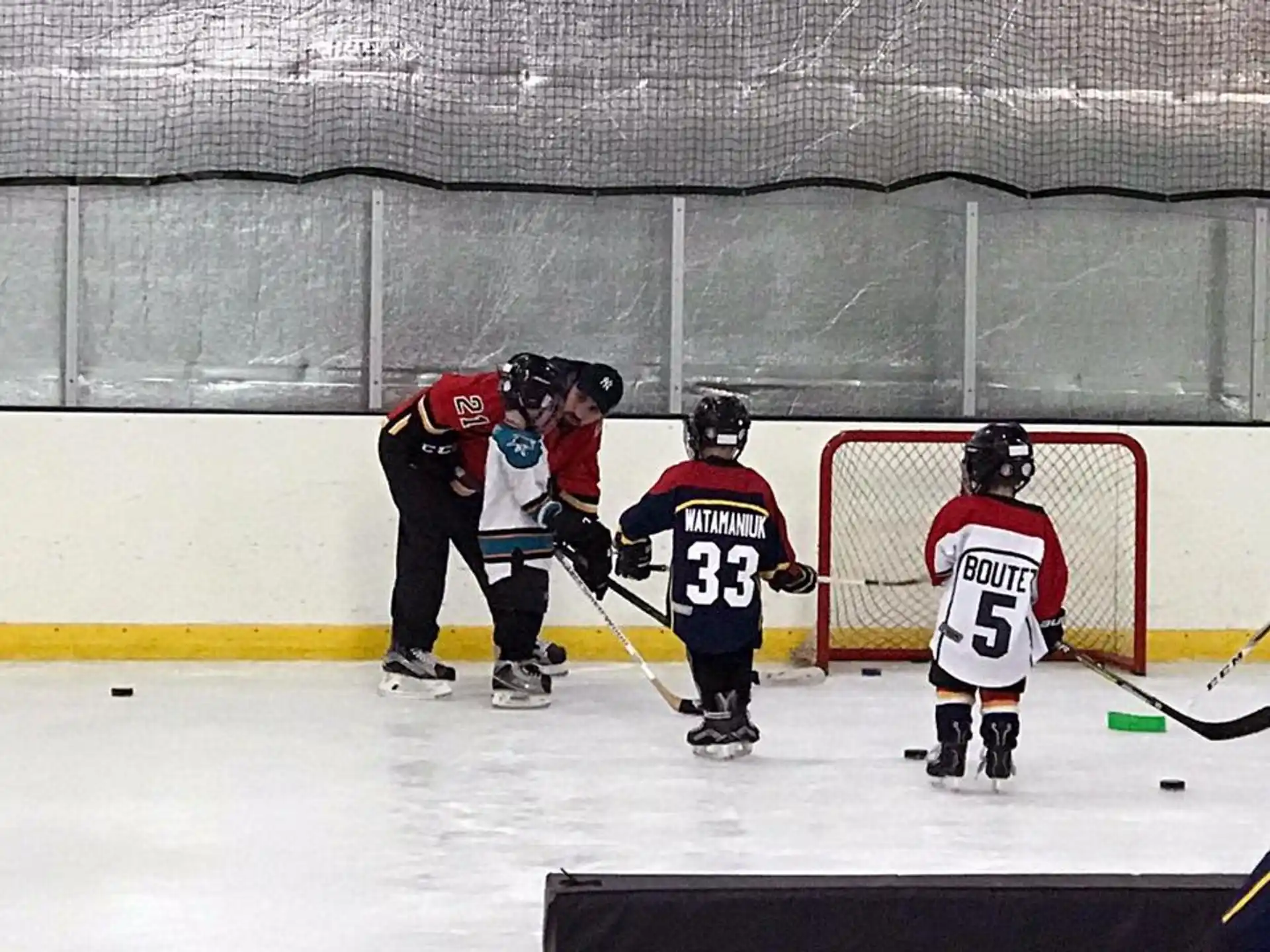 a group of people playing hockey
