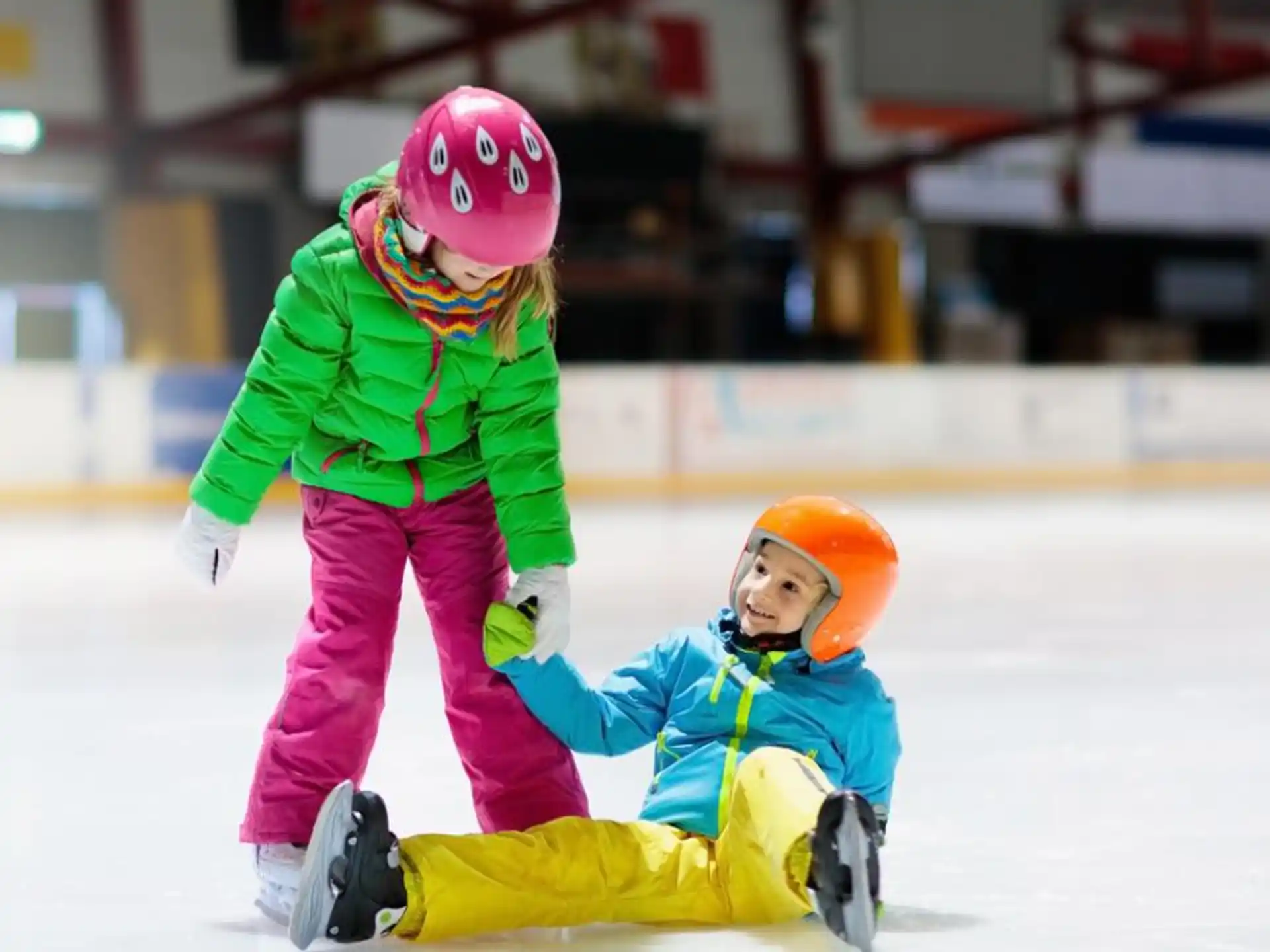 a person and a child ice skating