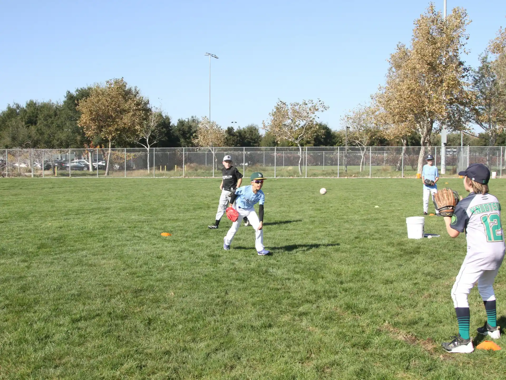 kids playing baseball on a field
