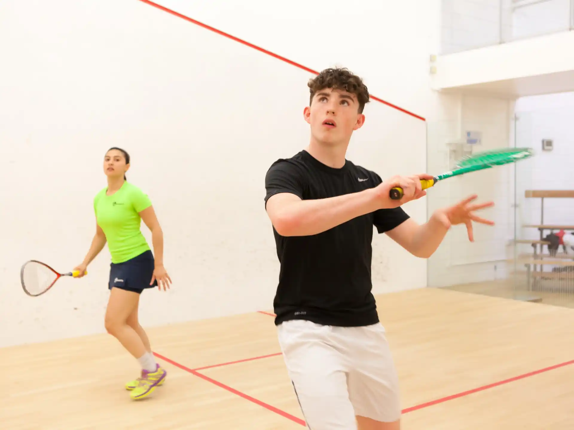 a man and a woman playing tennis