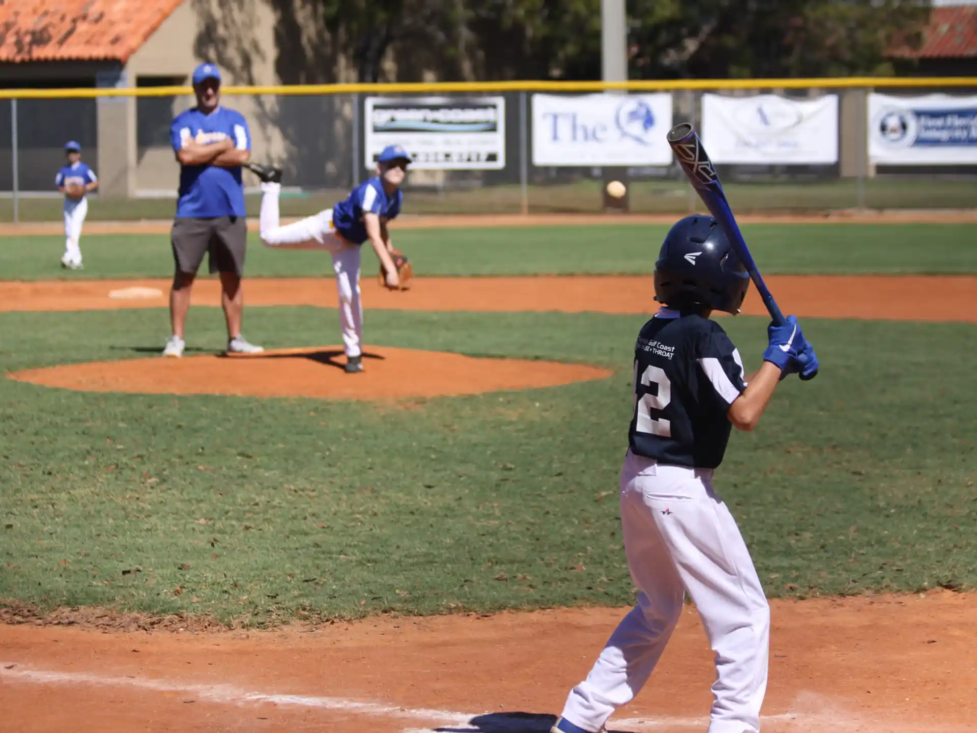 a baseball player prepares to swing a bat