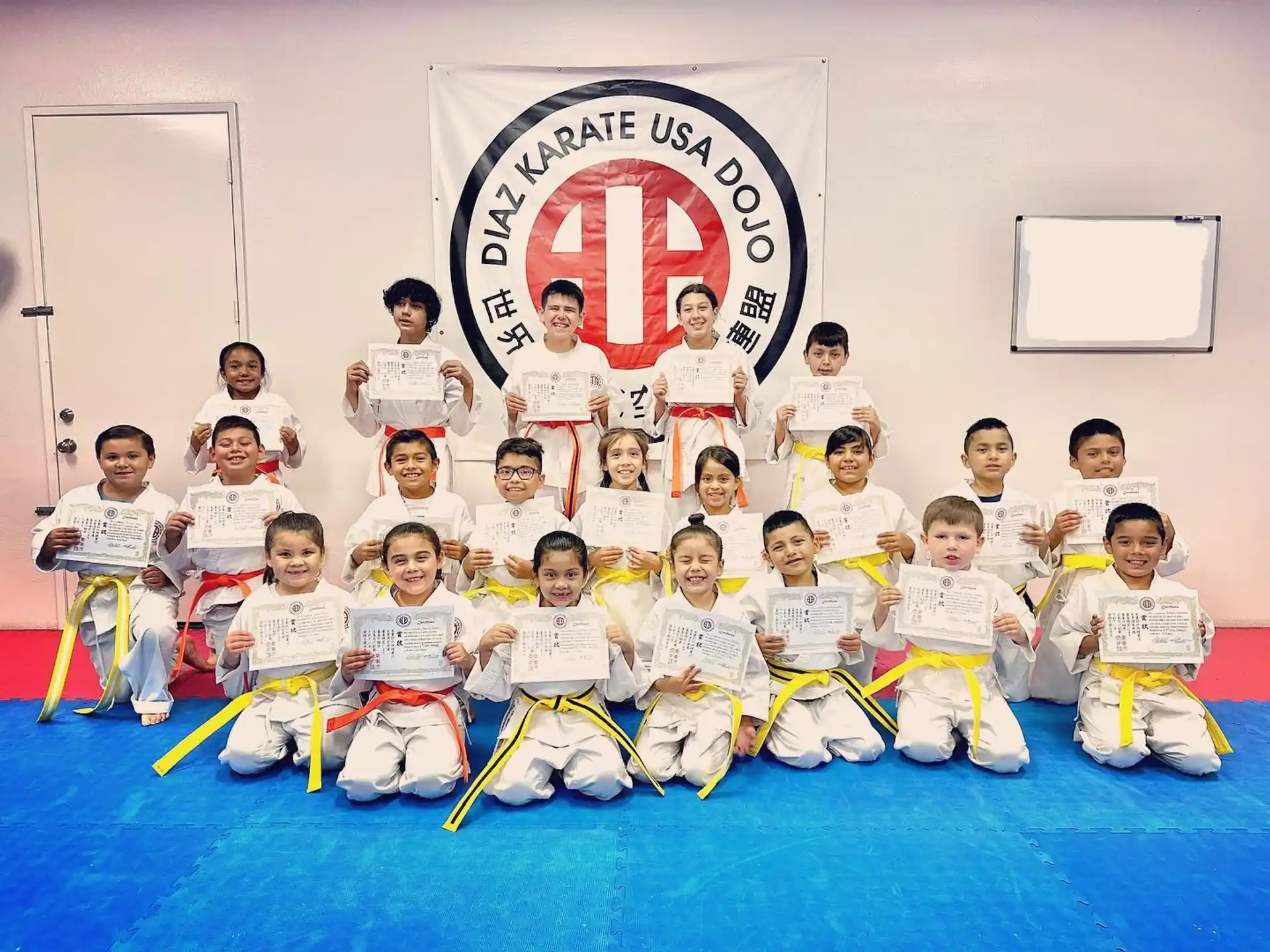 a group of people in karate uniforms