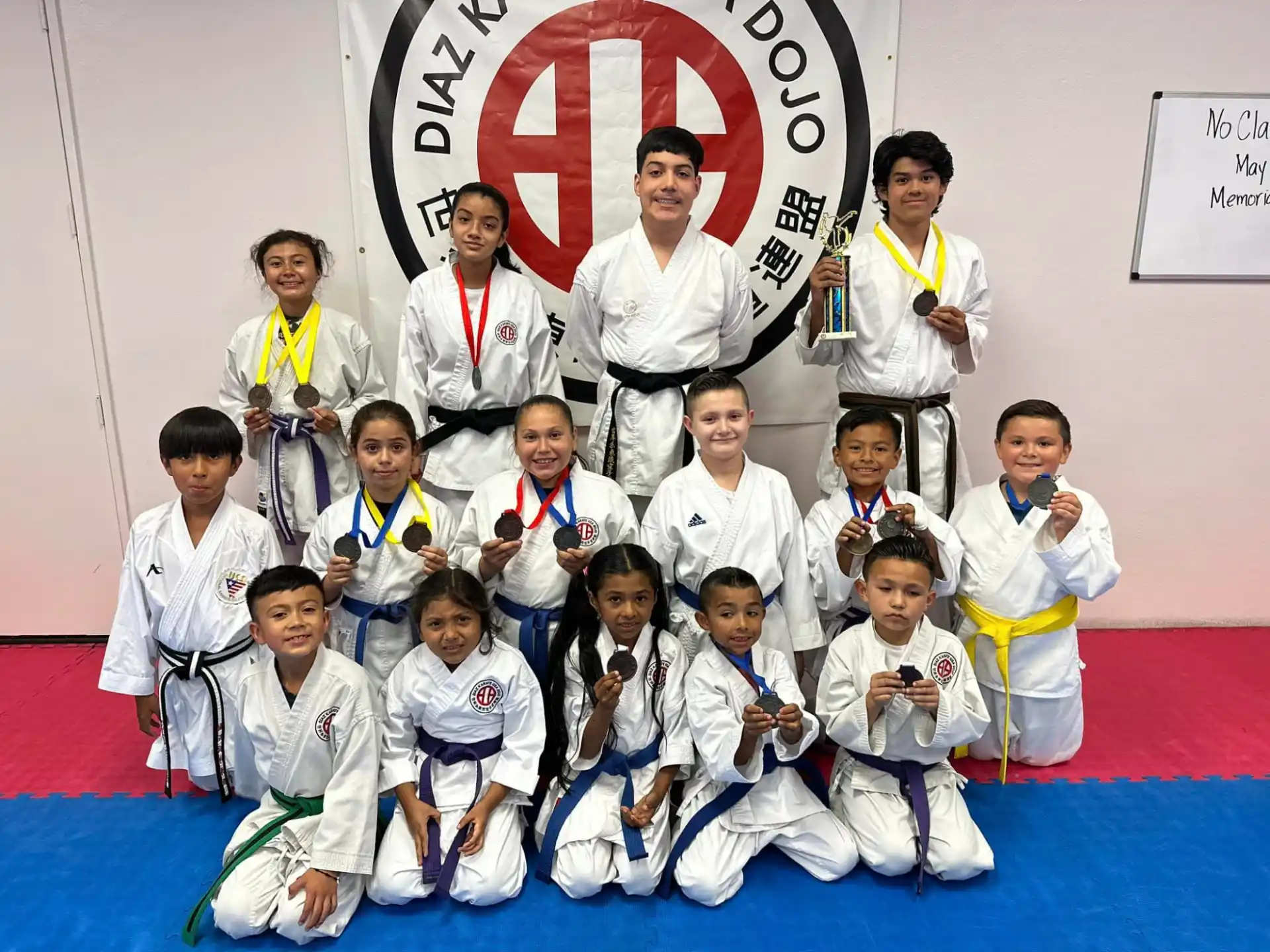 a group of people in karate uniforms
