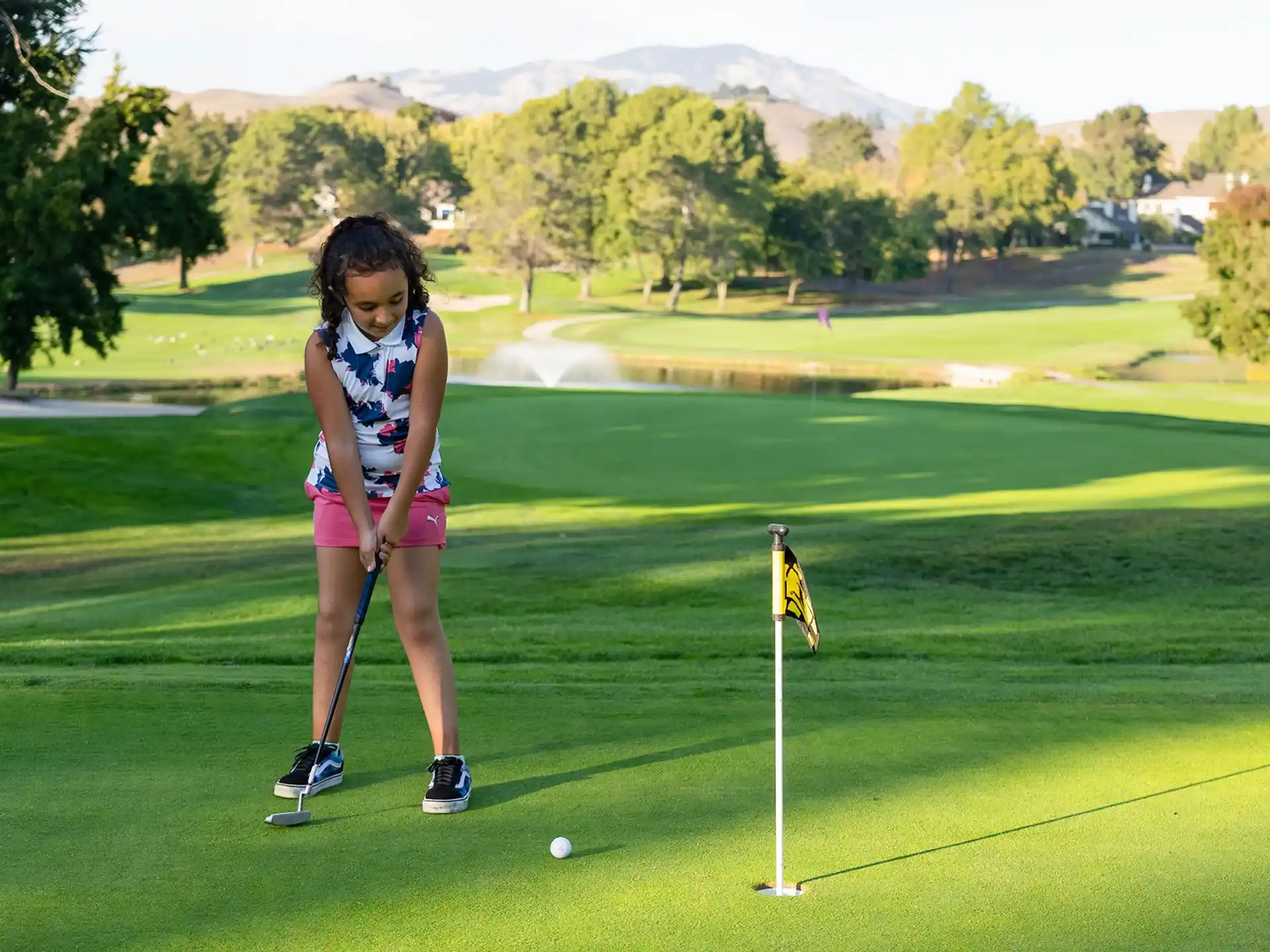 a girl playing golf