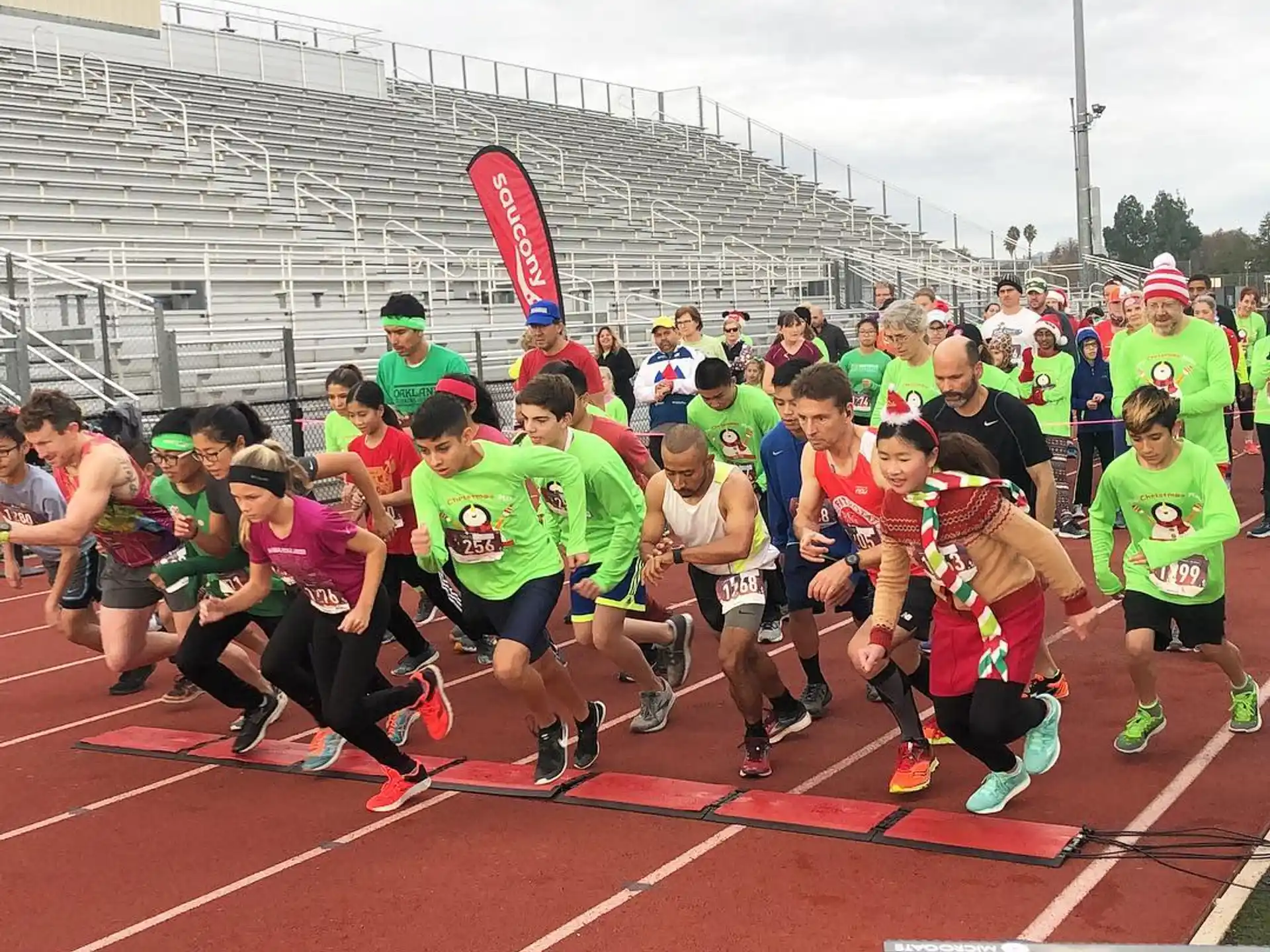 a group of people running on a track