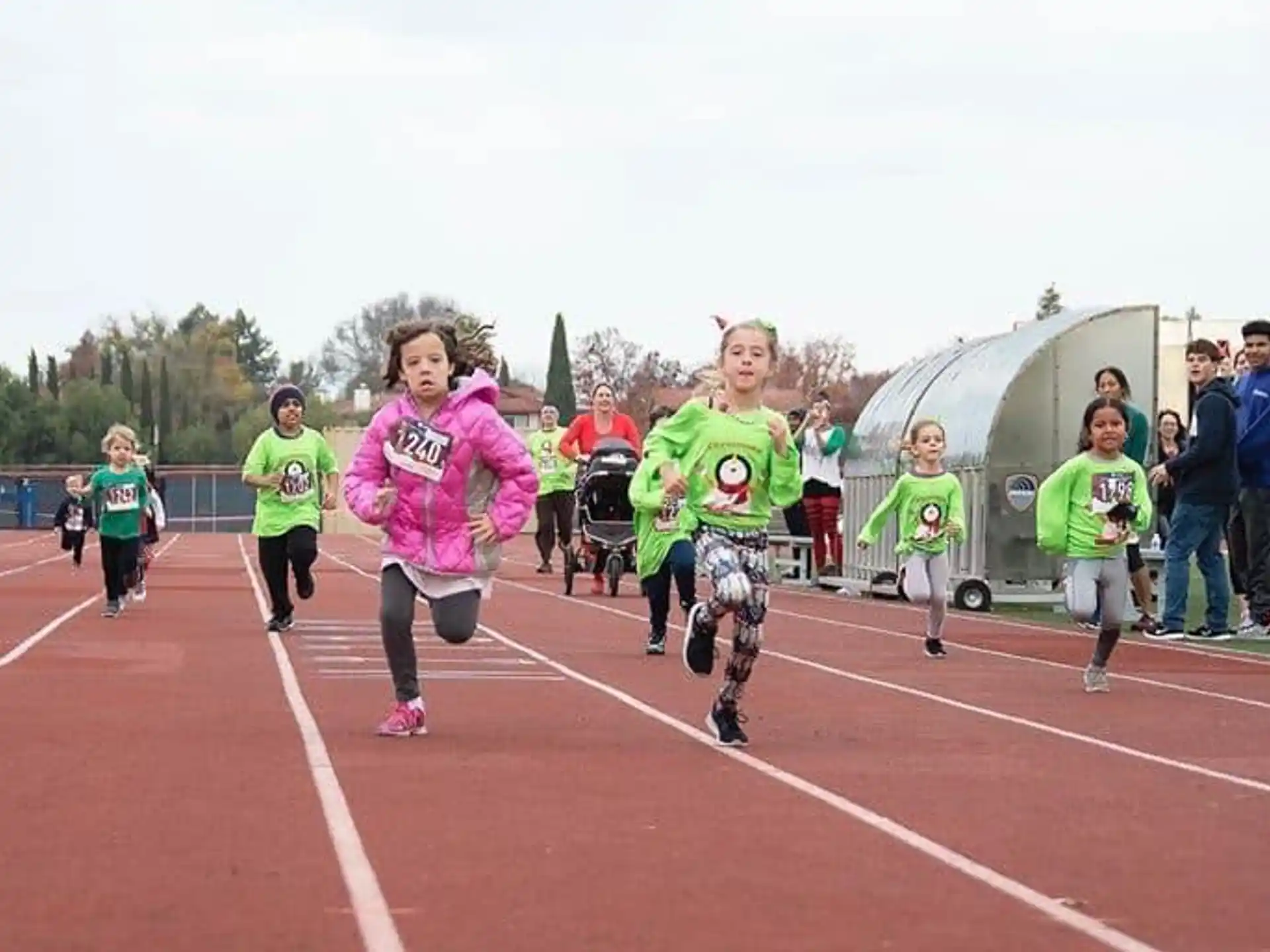 a group of people running on a track